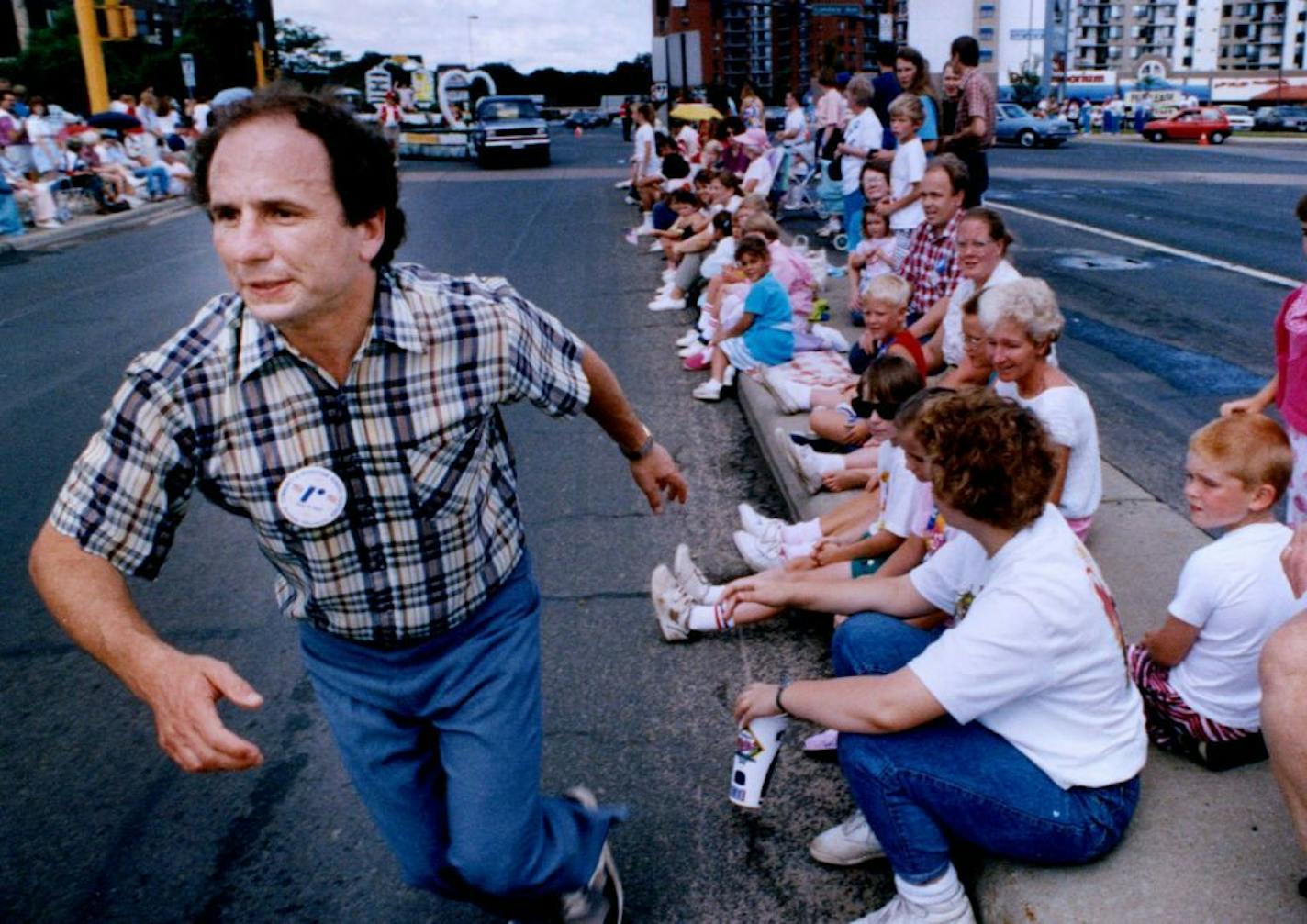 July 4, 1991 Sen. Paul Wellstone recovering from early political problems appearing at July 4 celebrations at Godfrey House and Richfield parade. Various of Wellstone at the Richfield Fourth of July parade on Lyndale Av., running down the street, stopping to greet spectators. July 5, 1991 Charles Bjorgen, Minneapolis Star Tribune