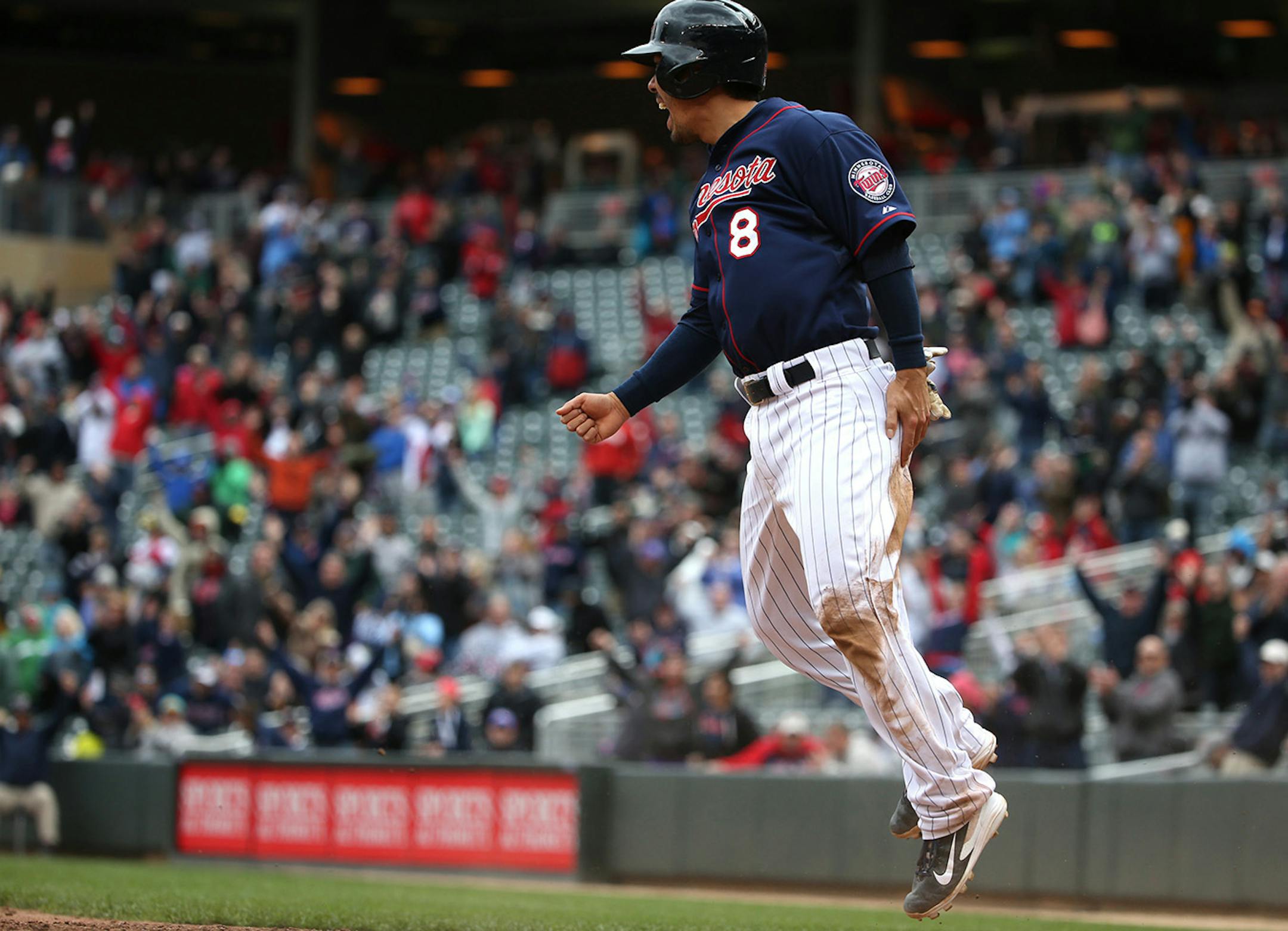 Twins Kurt Suzuki celebrated after across home plate as the winning run in the 10th inning.. ] (KYNDELL HARKNESS/STAR TRIBUNE) kyndell.harkness@startribune.com Twins won over the Boston Red Sox 4-3 in the 10th inning at Target Field in Minneapolis, Min. Thursday, May 15, 2014.