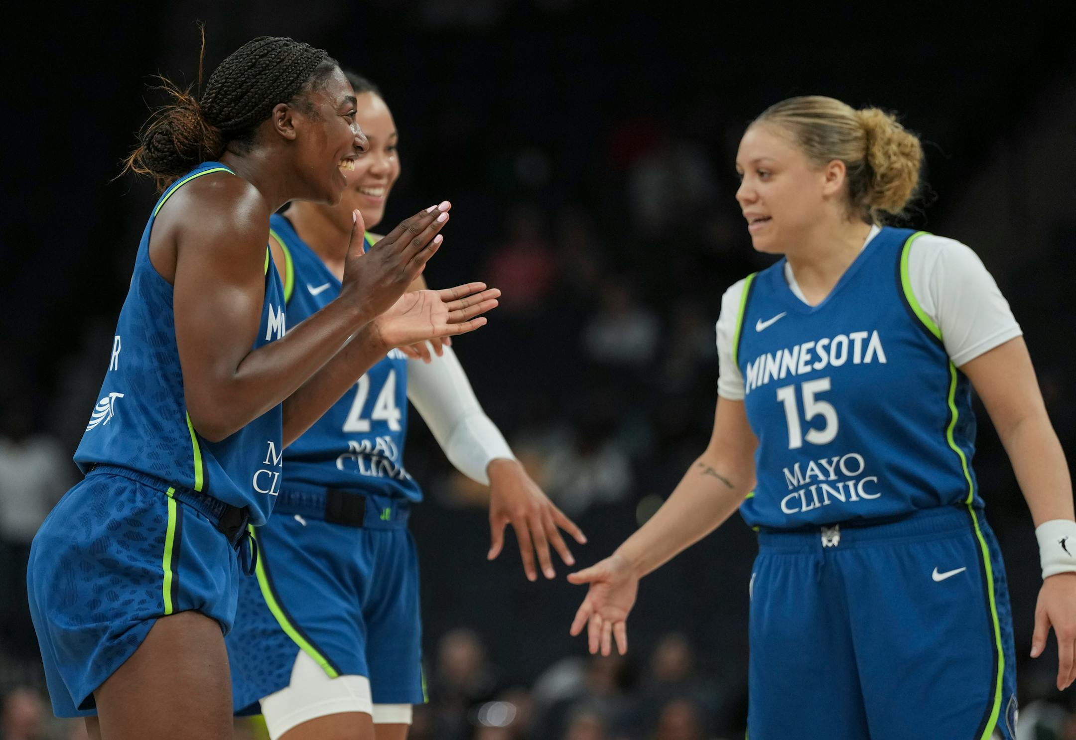 Minnesota Lynx guard Diamond Miller (1), forward Napheesa Collier (24) and guard Rachel Banham (15) celebrate taking a ten point lead in the last couple minutes in the second half. The Minnesota Lynx defeated the Seattle Storm 104-93 on Tuesday, June 27, 2023 at the Target Center in Minneapolis.