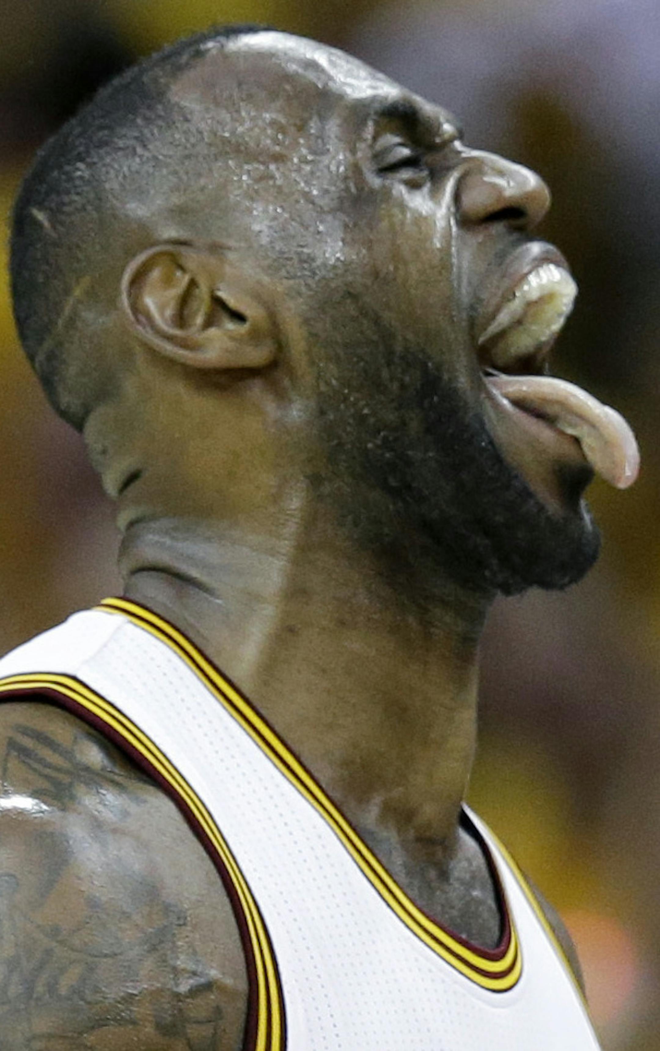 Cleveland Cavaliers' LeBron James (23) reacts during the first half against the Toronto Raptors in Game 1 of the NBA basketball Eastern Conference finals, Tuesday, May 17, 2016, in Cleveland. (AP Photo/Tony Dejak)