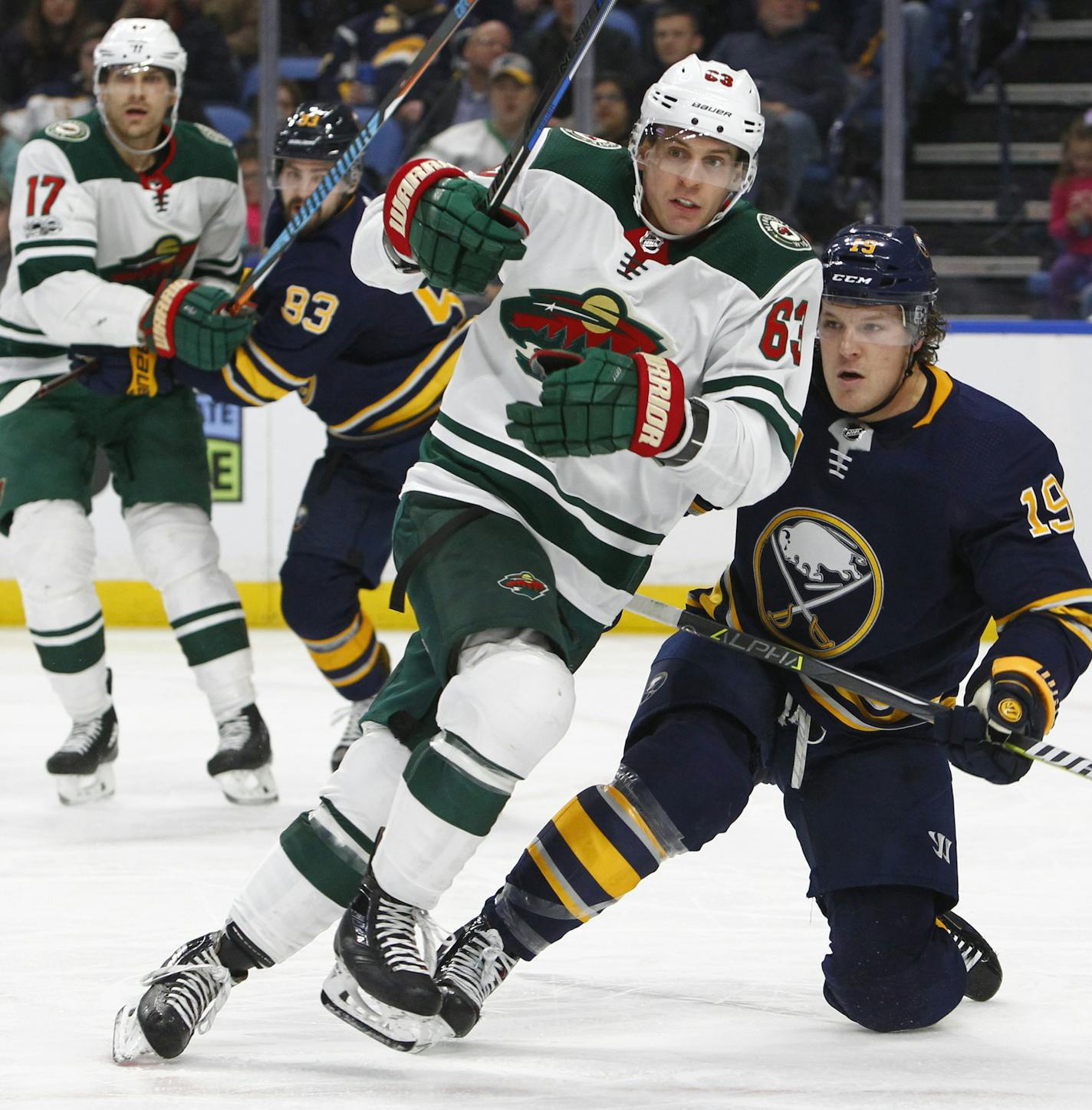 Minnesota Wild forward Tyler Ennis (63) skates past Buffalo Sabres defenseman Jake McCabe (19) during the second period of an NHL hockey game, Wednesday Nov. 22, 2017, in Buffalo, N.Y. (AP Photo/Jeffrey T. Barnes)