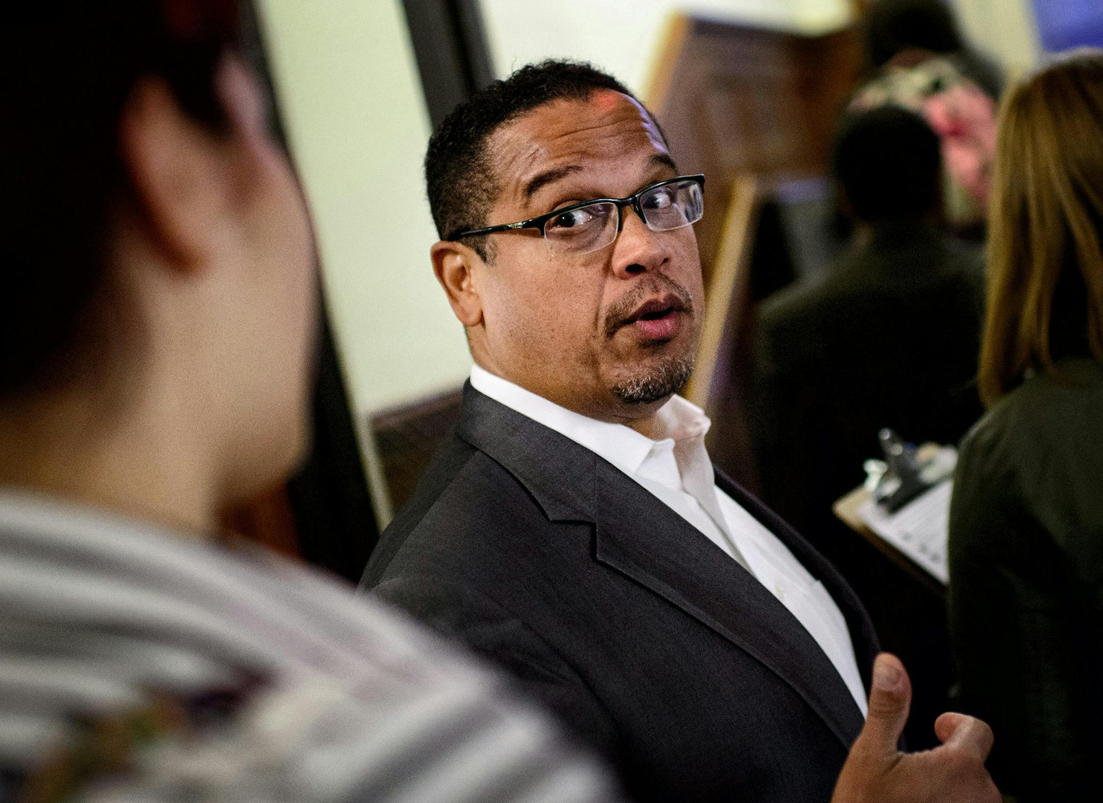 Rep Keith Ellison talked with volunteers on his way to knock on doors in the dorm. ] GLEN STUBBE * gstubbe@startribune.com Rep. Keith Ellison went door knocking with around 20 college Democrats in Pioneer Hall Dorm at the University of Minnesota, Minneapolis, to sign up new voters. Wednesday, October 8, 2014 ORG XMIT: MIN1410082227452878