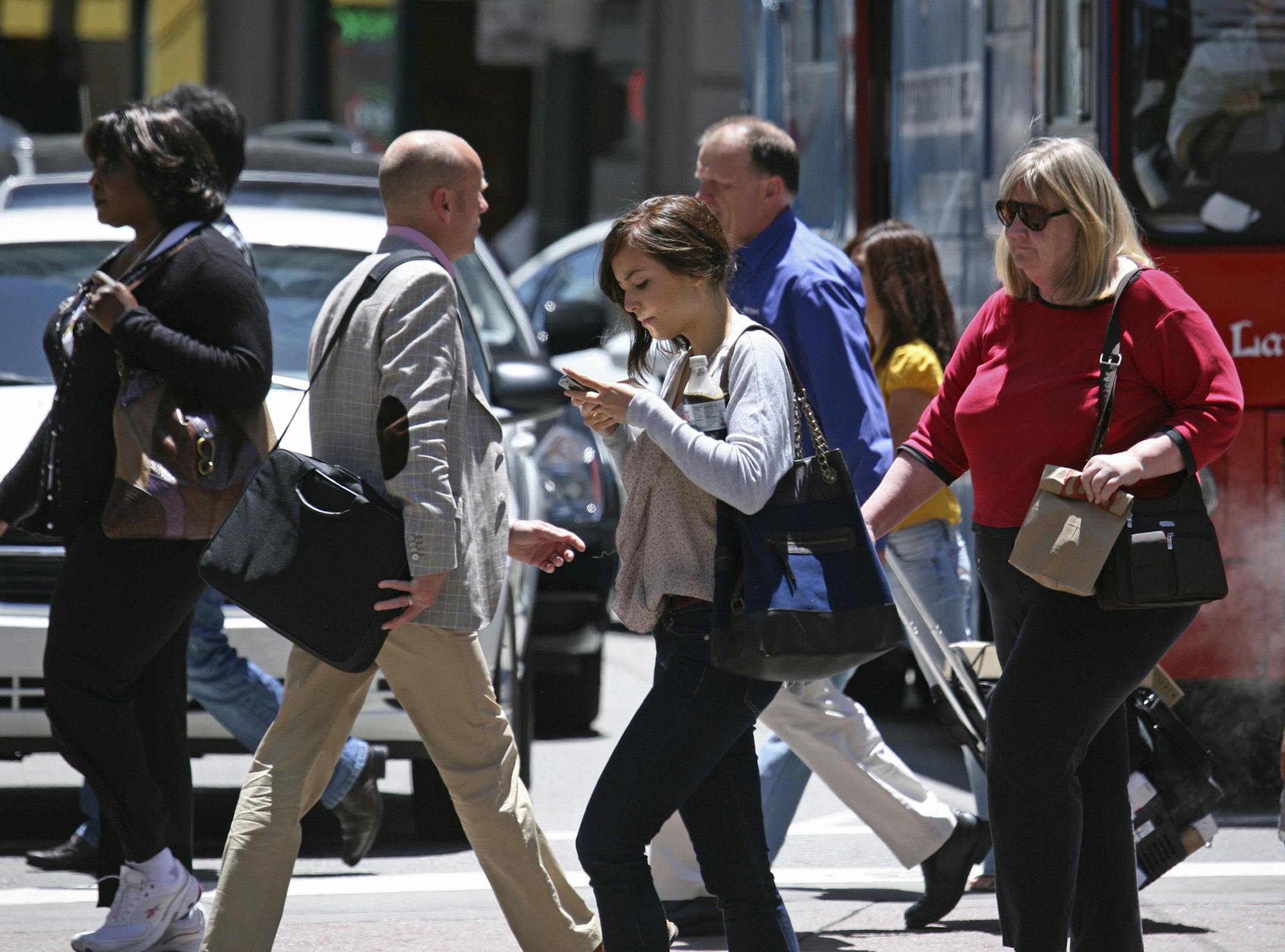 Honolulu in October will become the first U.S. city to impose fines if pedestrians text while walking crossing streets.