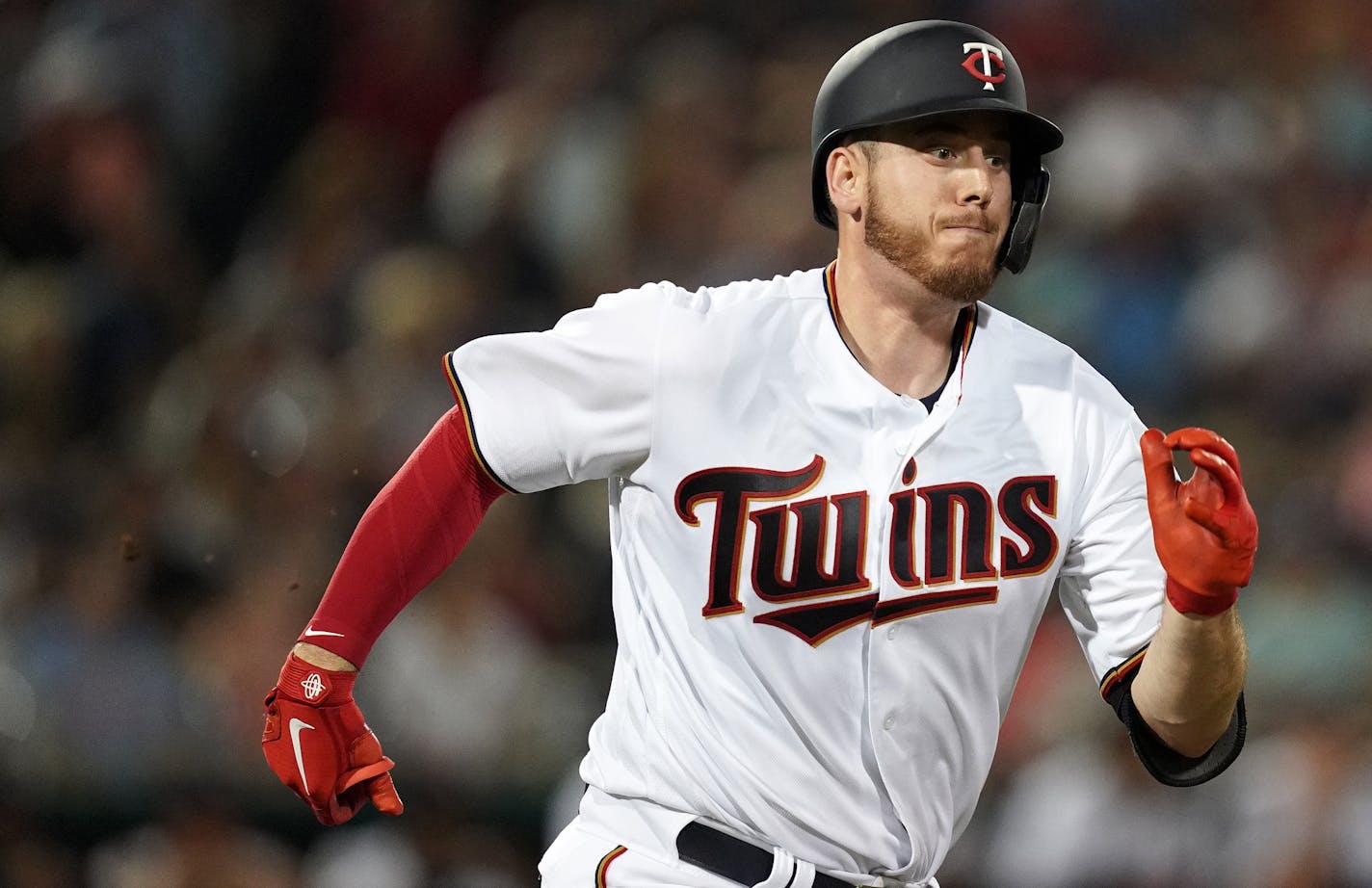 Minnesota Twins first baseman C.J. Cron (24) raced to first after connecting with the ball during Saturday's game. ] ANTHONY SOUFFLE &#x2022; anthony.souffle@startribune.com The Minnesota Twins played the Tampa Bay Rays in their first home Spring Training game Saturday, Feb. 23, 2019 at The CenturyLink Sports Complex's Hammond Stadium in Fort Myers, Fla.