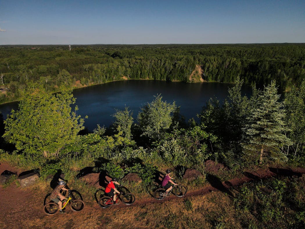 A group of bikers approached the top of the Miner's Mountain Overlook at Cuyuna Country State Recreation Area in 2021.