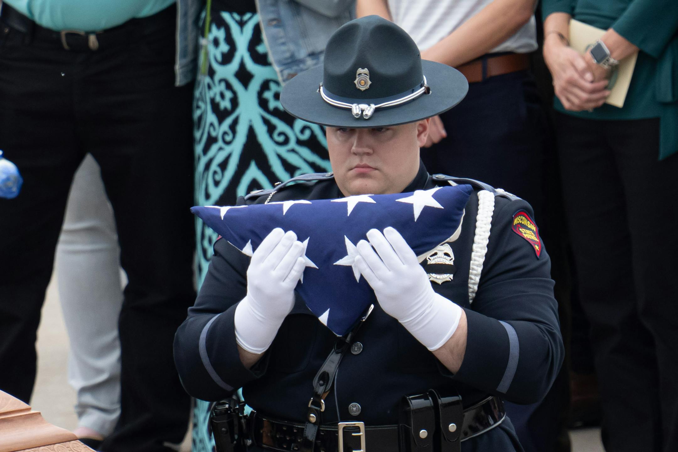Family members received a flded American flag.  Over a thousand law enforcement officers from around the U.S. gathered for Funeral services for St. Croix County Sheriff's Deputy Kaitie Leising who was shot and killed on Saturday evening Friday, May 12, 2023  Hudson, Wis.
