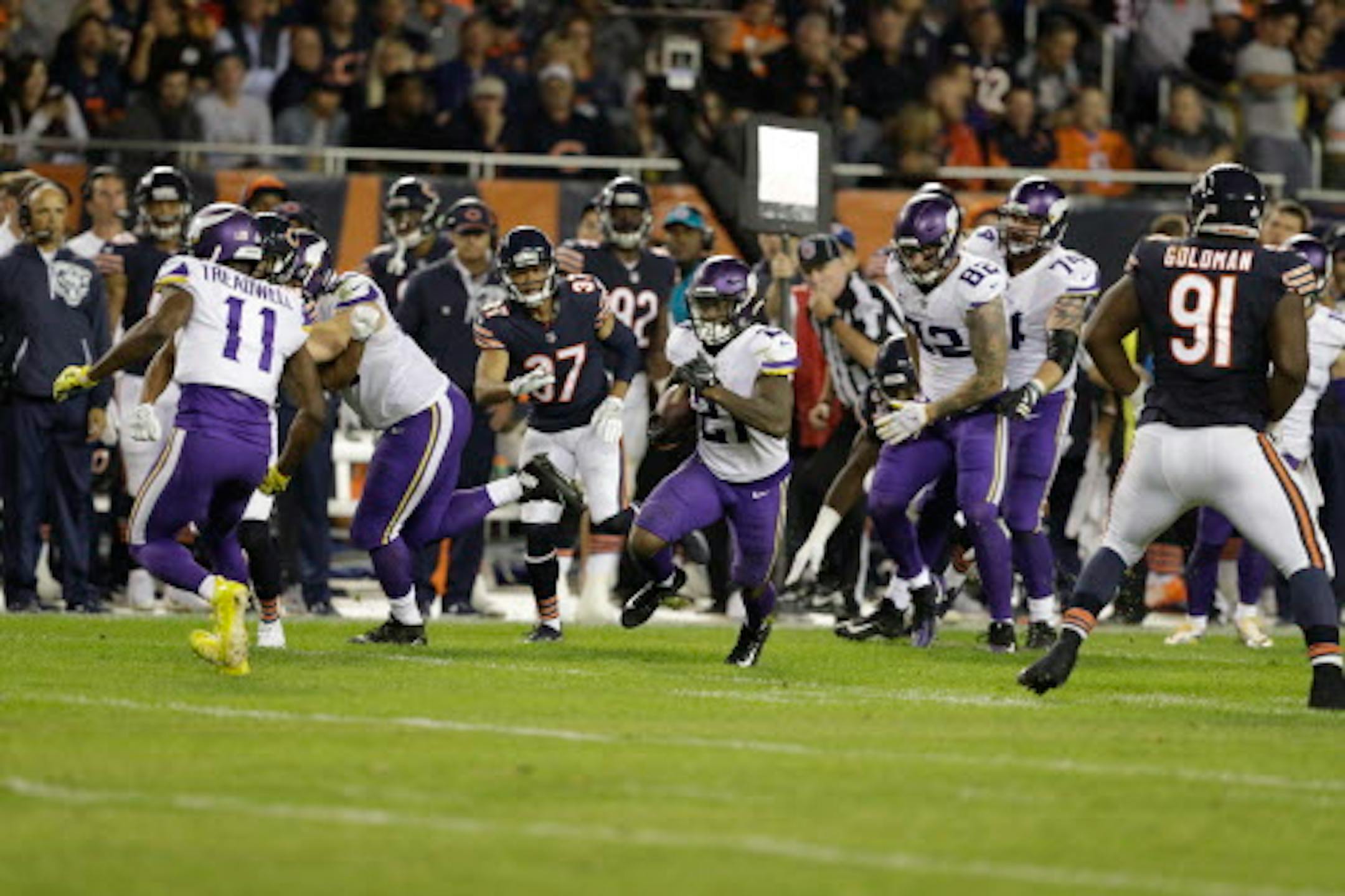 Minnesota Vikings running back Jerick McKinnon (21) breaks away from Chicago Bears defense for a touchdown during the second half of an NFL football game, Monday, Oct. 9, 2017, in Chicago. (AP Photo/Darron Cummings)