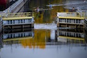 Paddlers approached an opening gate as they made their way through a lock in October at Lock and Dam 1 in Minneapolis. The Army Corps of Engineers is 
