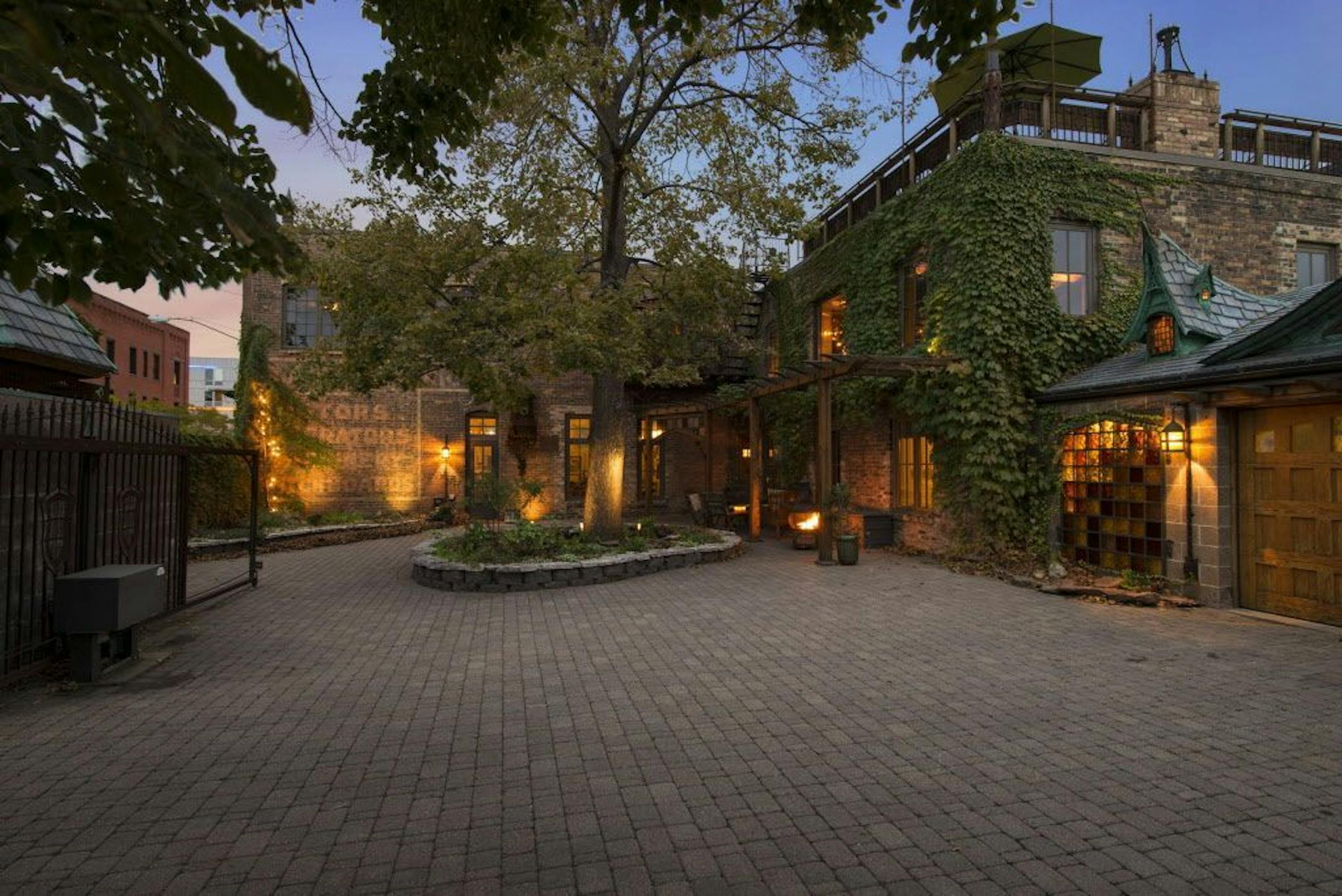 The house has a large gated courtyard. It's built in a structure that was originally a blacksmith's shop.