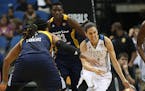Lynx reserve guard Anna Cruz dribbled passed Indiana's Erlana Larkins during the first half of Game 2 of the WNBA Finals at Target Center on Tuesday.