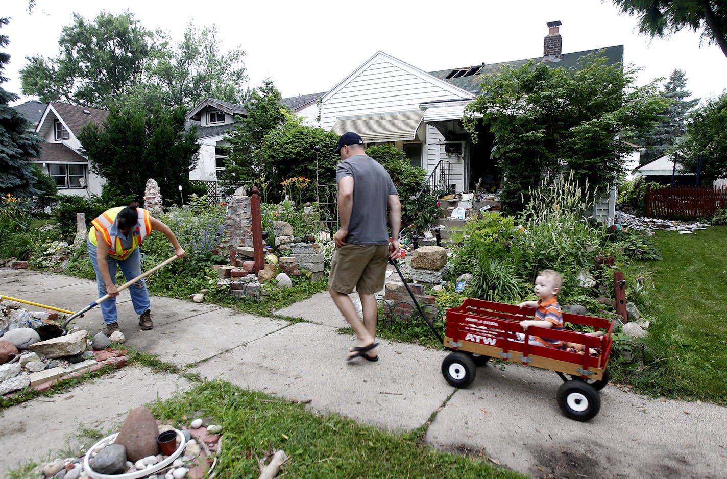 St. Paul Fire crew and city officials worked on the aftermath of a fire at 1485 Hamline Avenue North in St. Paul, MN, Tuesday July 9, 2013.(ELIZABETH FLORES/STAR TRIBUNE) ELIZABETH FLORES &#x2022; eflores@startribune.com