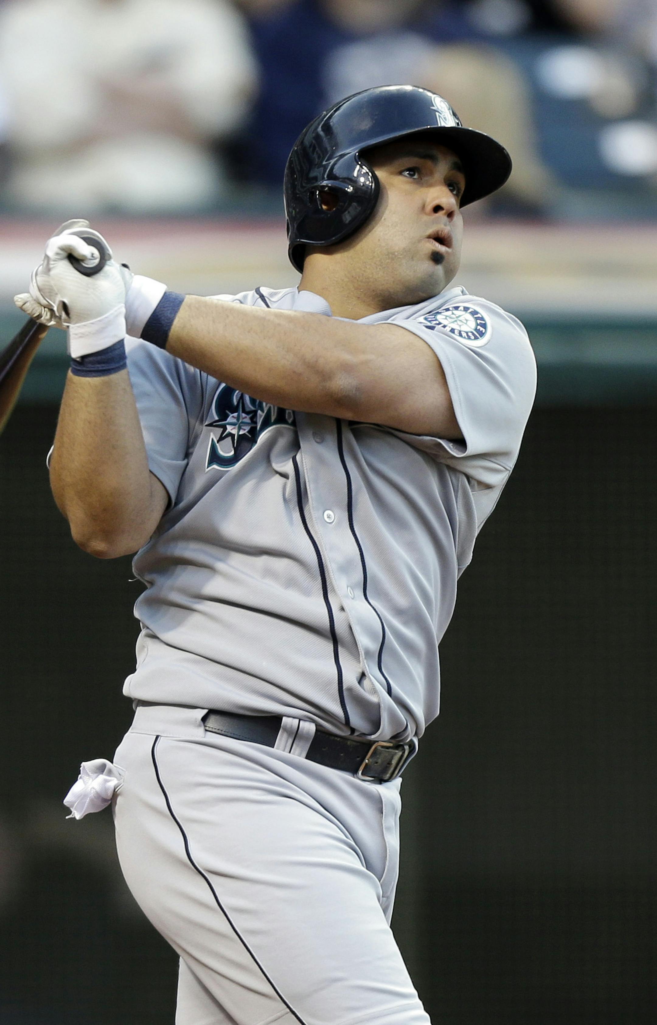Seattle Mariners' Kendrys Morales homers against the Cleveland Indians in a baseball game Friday, May 17, 2013, in Cleveland. (AP Photo/Mark Duncan) ORG XMIT: CDB