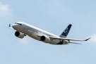 An Airbus A220 lands at Toulouse-Blagnac airport, July 10, 2018, in southwestern France. Federal regulators are investigating how parts made with coun