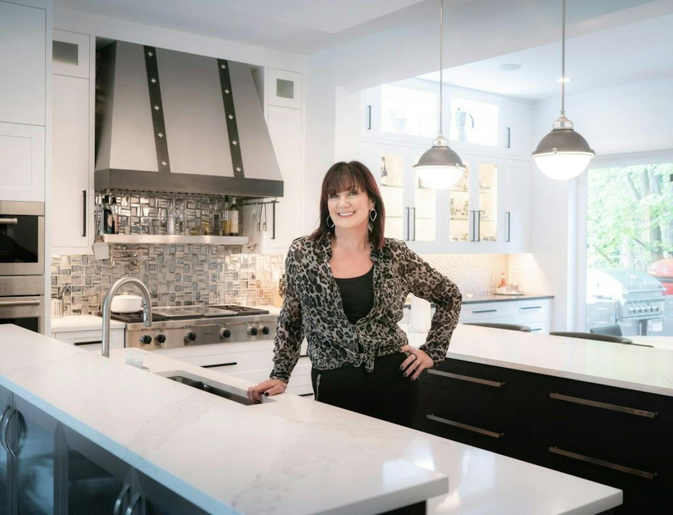 Homeowner Sandi Adams in the remodeled chef's kitchen.
