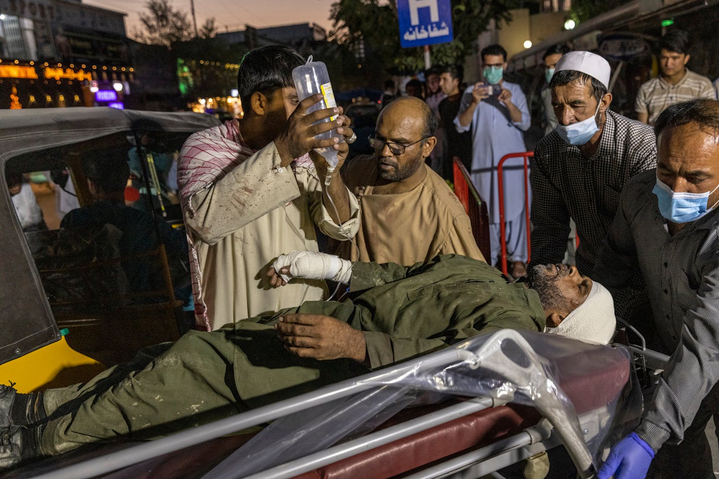 A person wounded in a bomb blast outside the Kabul airport in Afghanistan on Thursday, Aug. 26, 2021, arrives at a hospital in Kabul. The Pentagon confirmed at least two blasts outside the Kabul airport and said there were a number of casualties, after Western governments warned of a security threat there. (Victor J. Blue/The New York Times)