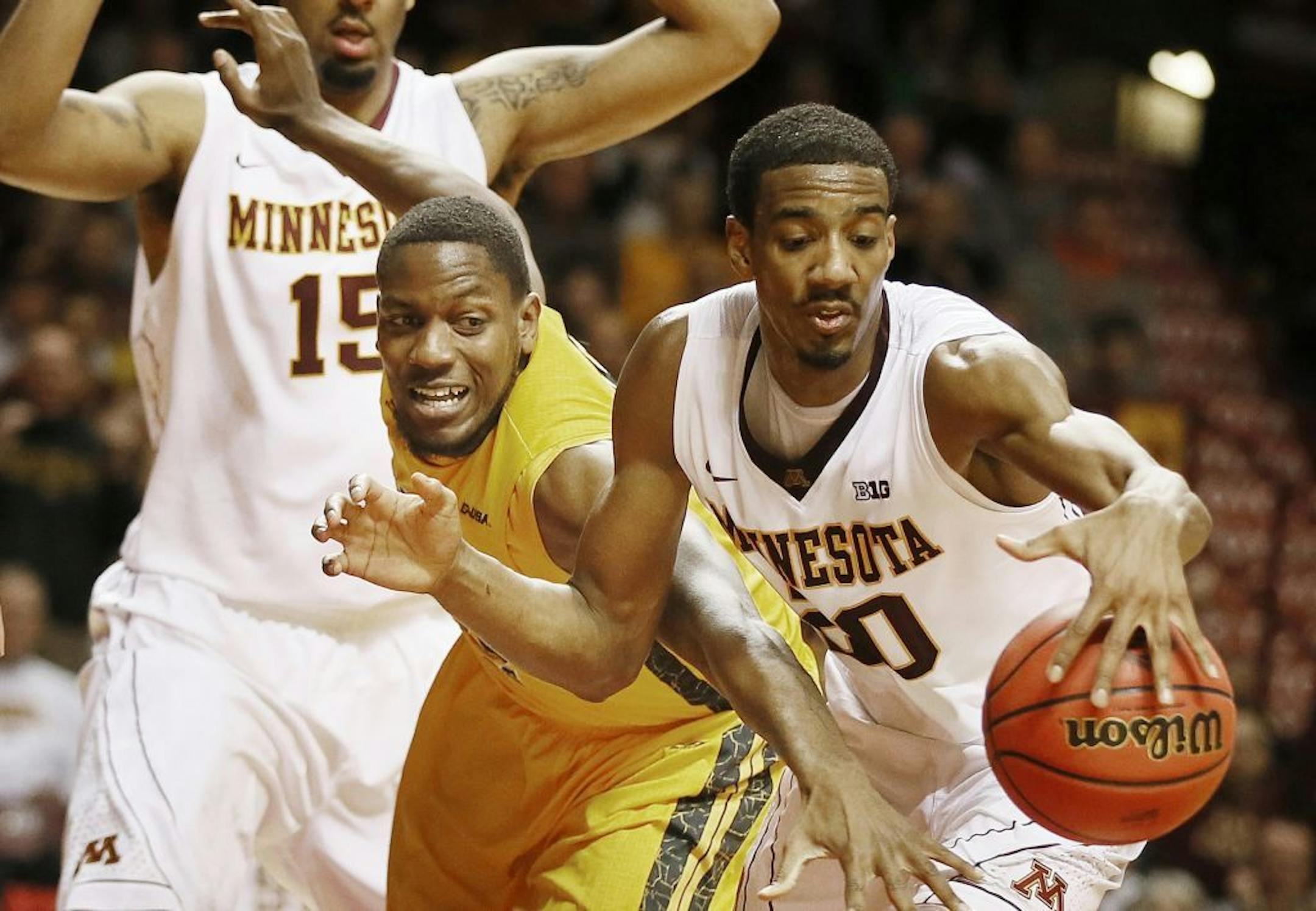 Gophers guard Austin Hollins (20) stole the ball from Southern Mississippi's Jeremiah Eason on Tuesday in Minneapolis.