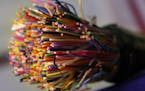 FILE - This July 9, 2015 file photo shows a bundle of insulated copper telephone cables during a news conference on copper and metal theft, at the Ark