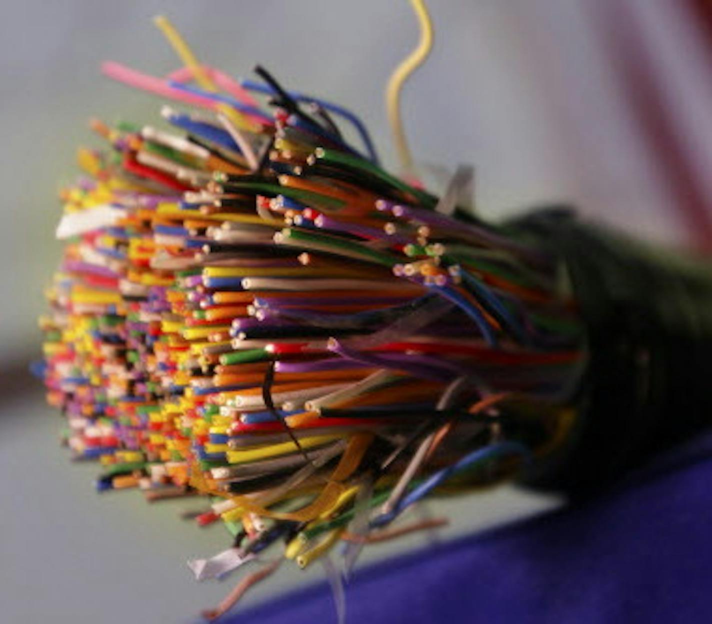 FILE - This July 9, 2015 file photo shows a bundle of insulated copper telephone cables during a news conference on copper and metal theft, at the Arkansas state Capitol in Little Rock, Ark. On Thursday, Aug. 6, 2015, the Federal Communications Commission is expected to require that phone companies warn residential customers three months before they abandon a copper network. For businesses, six months&#xed; notice would be required. (AP Photo/Danny Johnston, File)