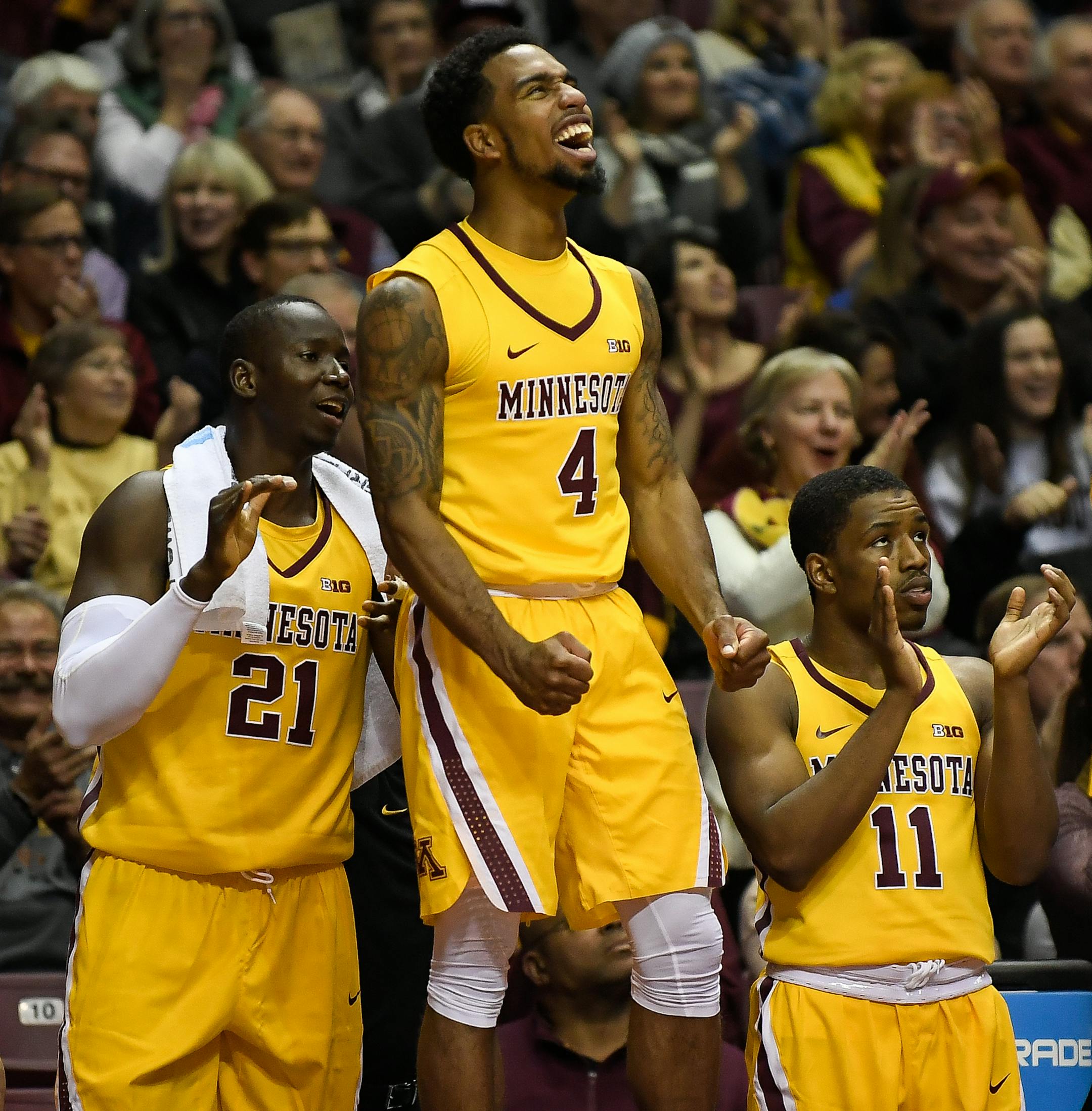 Minnesota Golden Gophers guard Jamir Harris (4), center Bakary Konate (21) and guard Isaiah Washington (11) celebrated as Minnesota regained their momentum midway through the second half against the Niagara Purple Eagles. ] AARON LAVINSKY &#xef; aaron.lavinsky@startribune.com The University of Minnesota Golden Gophers men's basketball team played the Niagara Purple Eagles on Wednesday, Nov. 15, 2017 at Williams Arena in Minneapolis, Minn.