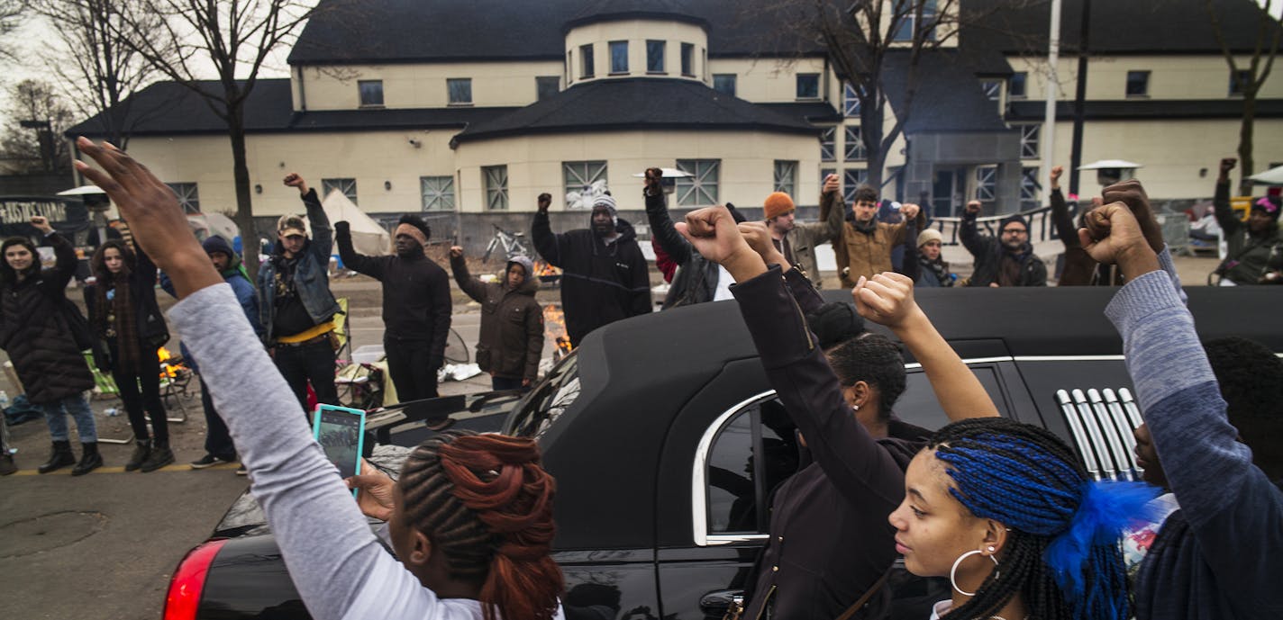 At the funeral procession for Jamar Clark at the Police 4th Precinct, family members got out of the limousine to show show support for the Black Lives Matter supporters. ]Richard Tsong-Taatarii/rtsong-taatarii@startribune.com ORG XMIT: MIN1511251533510490