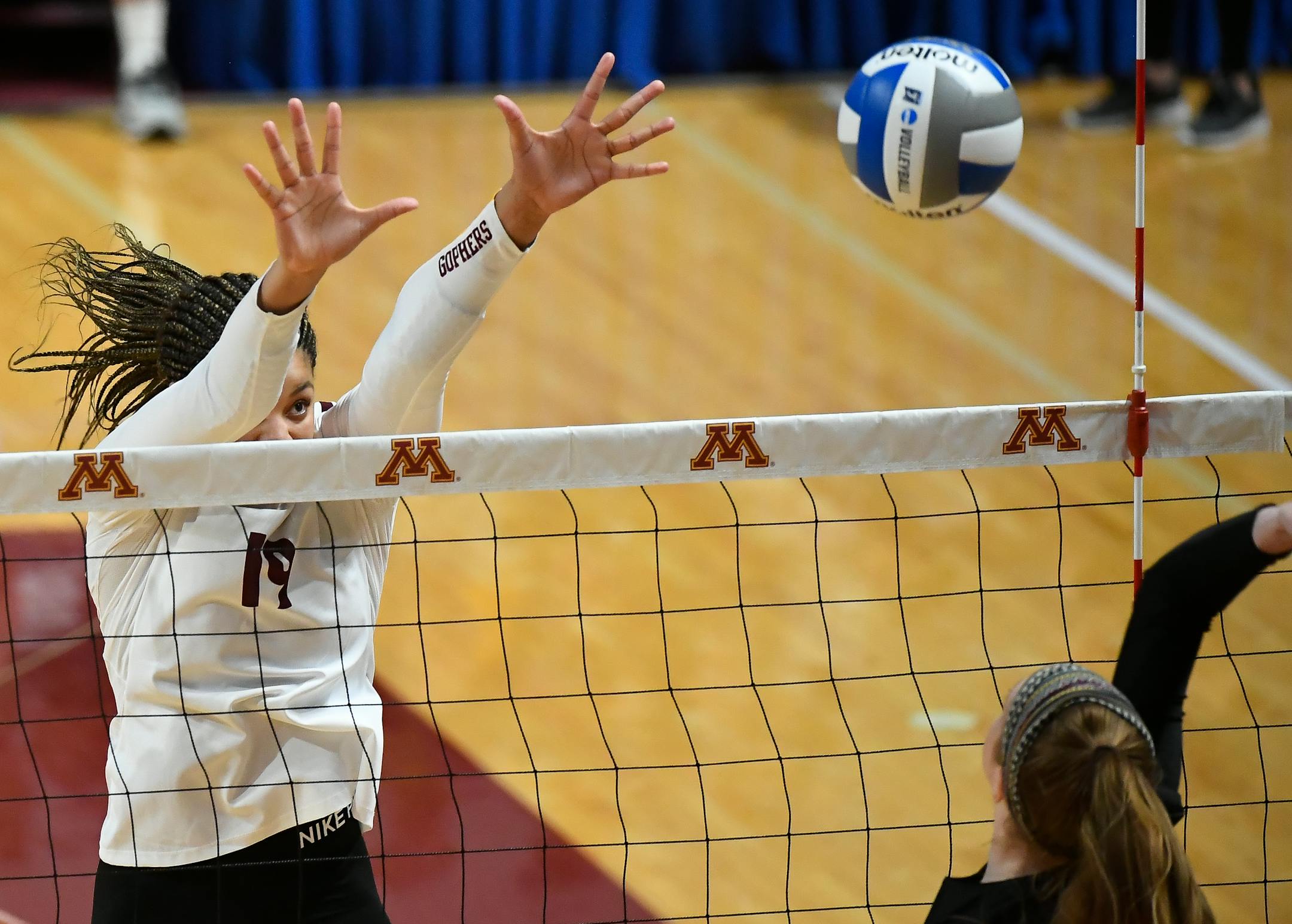 Gophers outside hitter Alexis Hart jumped for a block against Bryant middle blocker Grace Richmeyer