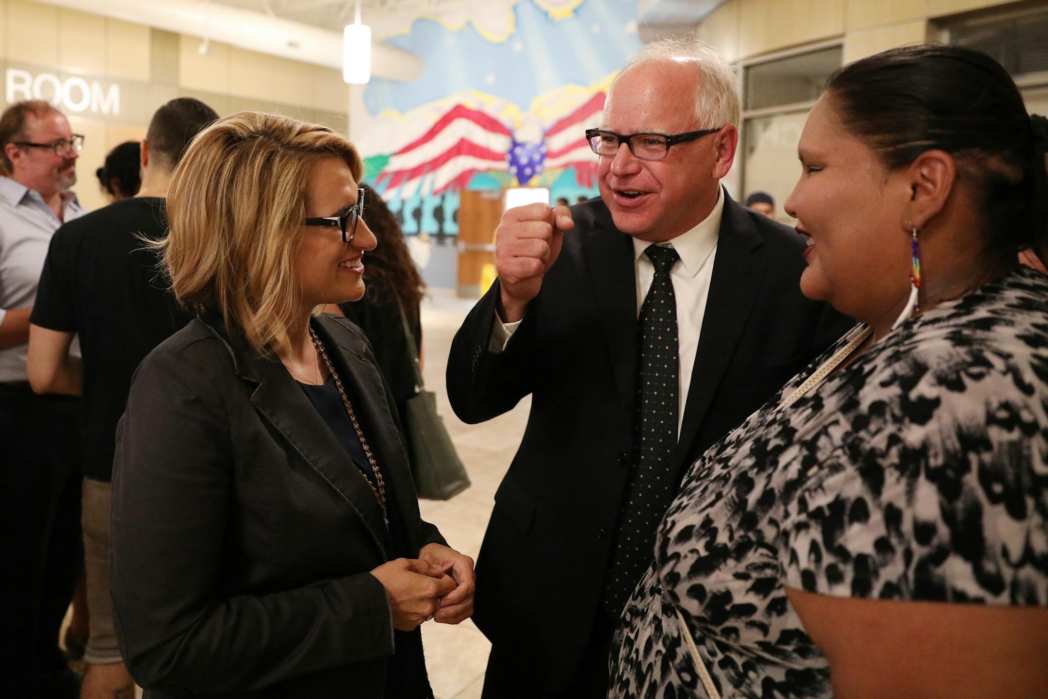 DFL candidate for governor Tim Walz talked with his running mate Peggy Flanagan as they greeted staff and supporters during their night party at the Carpenters Union Hall.