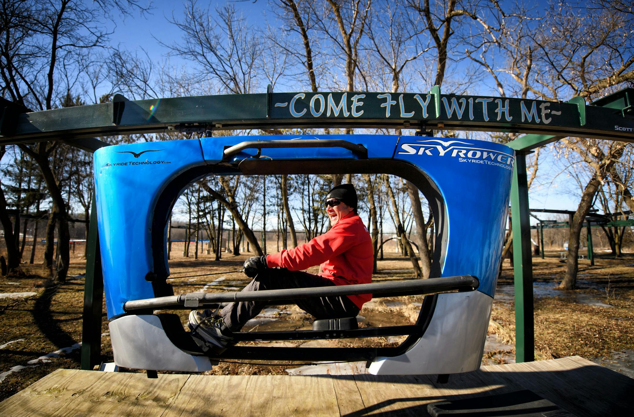 Scott Olson took his prototype Skyrower for a spin around the test track at his Waconia home. It is similar to the Skyride but is propelled by rowing rather than pedals. ] GLEN STUBBE &#x2022; glen.stubbe@startribune.com Tuesday February 14, 2017 Scott Olson, a Minnesota inventor who invented Rollerblades, has invented a new pedal-driven "Skyride" monorail system being used on Carnival cruises