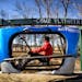 Scott Olson took his prototype Skyrower for a spin around the test track at his Waconia home. It is similar to the Skyride but is propelled by rowing 