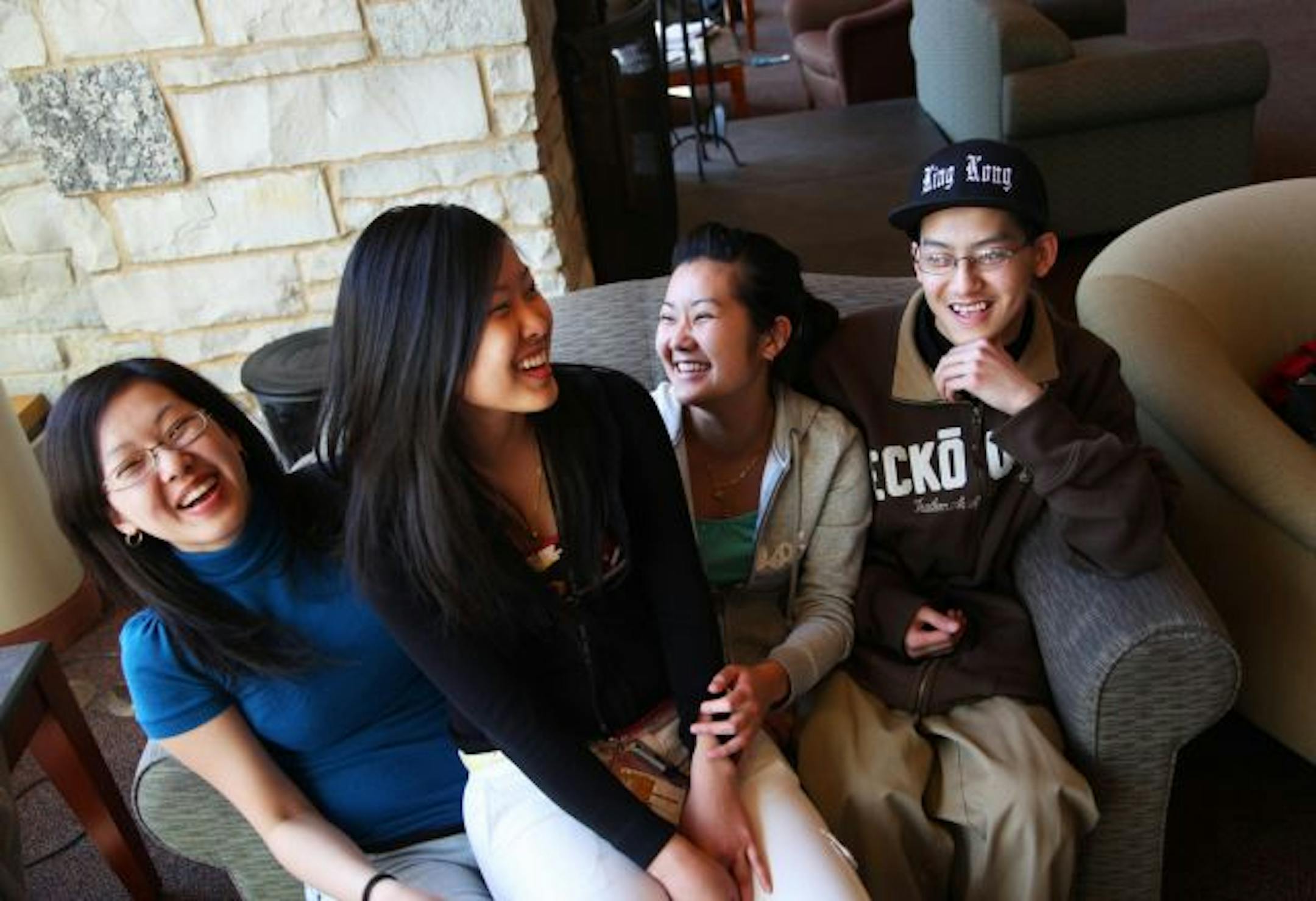 The Yang siblings laughed as they described each other while gathered together recently. From the left are Sandy, 22, Nou, 19, Betty, 20, and Kong Yang, 18.