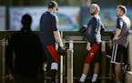 Twins pitchers Phil Hughes, left, and Glen Perkins, shown at spring training in 2014, had some fun on Twitter as they headed to Fort Myers, Fla., this
