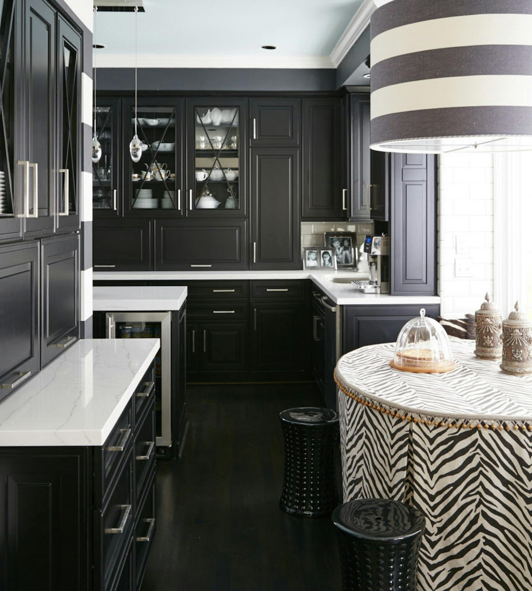 Transitional black and white kitchens are on trend and rising in popularity. Omega's transitional Clio door style in a black opaque finish pairs here with Cambria's Ella quartz countertops to reflect a look that is both fresh and timeless. MUST CREDIT: Photo by Vern Yip for The Washington Post.