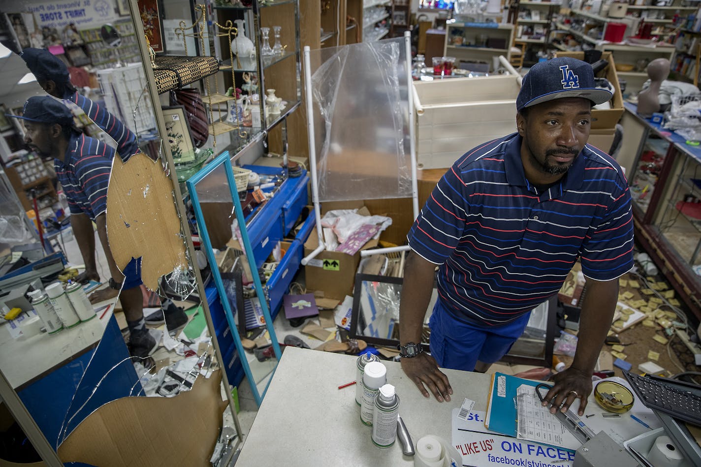 Wayne Berg worked with his staff on repairing and cleaning the heavily damaged St. Vincent de Paul thrift store, Friday, June 5, 2020 in Minneapolis, MN. Wayne Bugg said he'd seen anything like it in his life. Bugg is a former crack dealer with crack-addicted parents. About 23 years ago he started working at St. Vincent where he was encouraged to do something better with his life and paid his college tuition. Now he's St. Vincent's assistant executive director known for reaching out to help peop