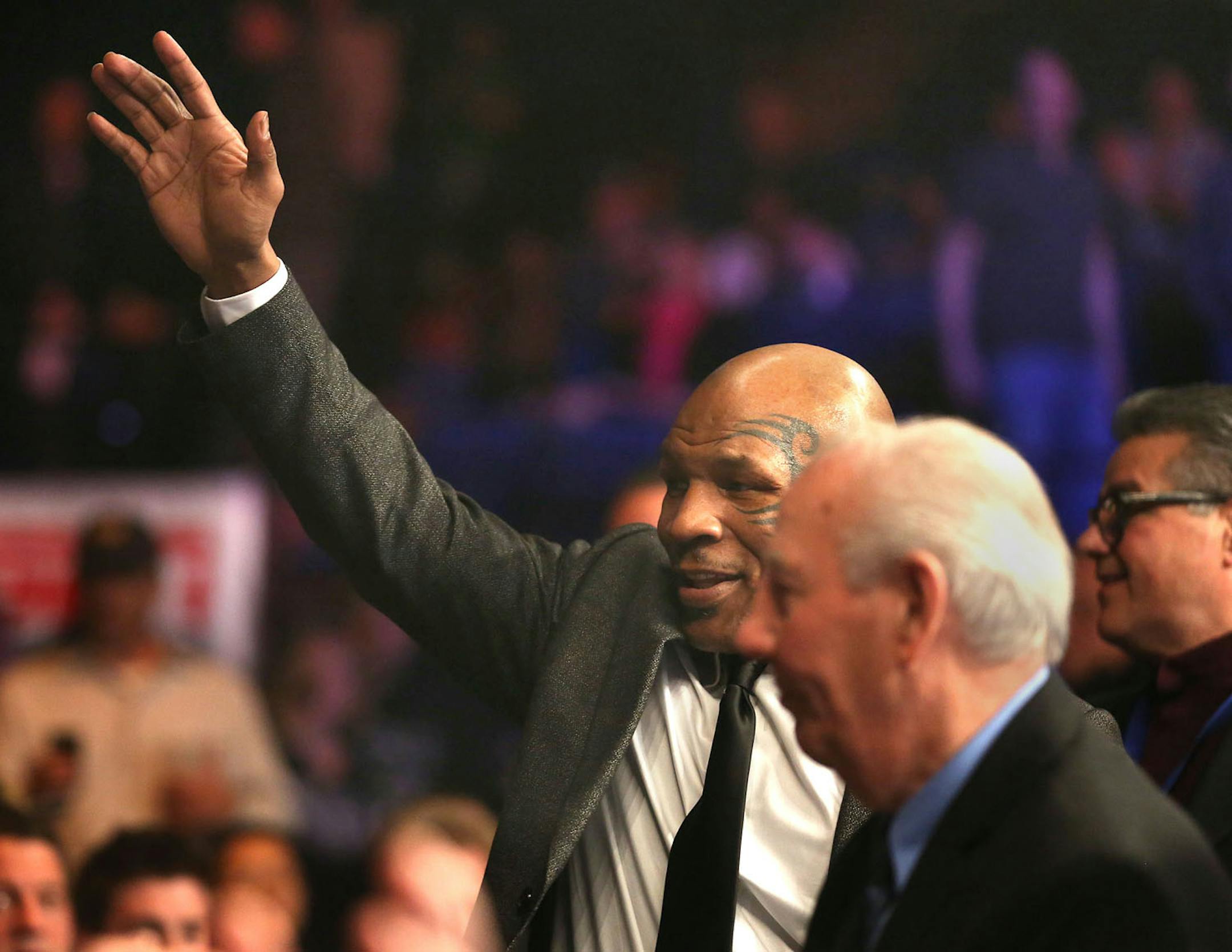Ex-boxer Mike Tyson waved to the crowd before the bout of Ossie Duran aka - The Ghanaian Gladiator and USBA Middleweight Champion Caleb Truax, of Osseo, Minnesota the semi final fight at Target Center in Minneapolis Friday, January 3, 2014. The bout ended in a tie 95-95. ] (KYNDELL HARKNESS/STAR TRIBUNE) kyndell.harkness@startribune.com