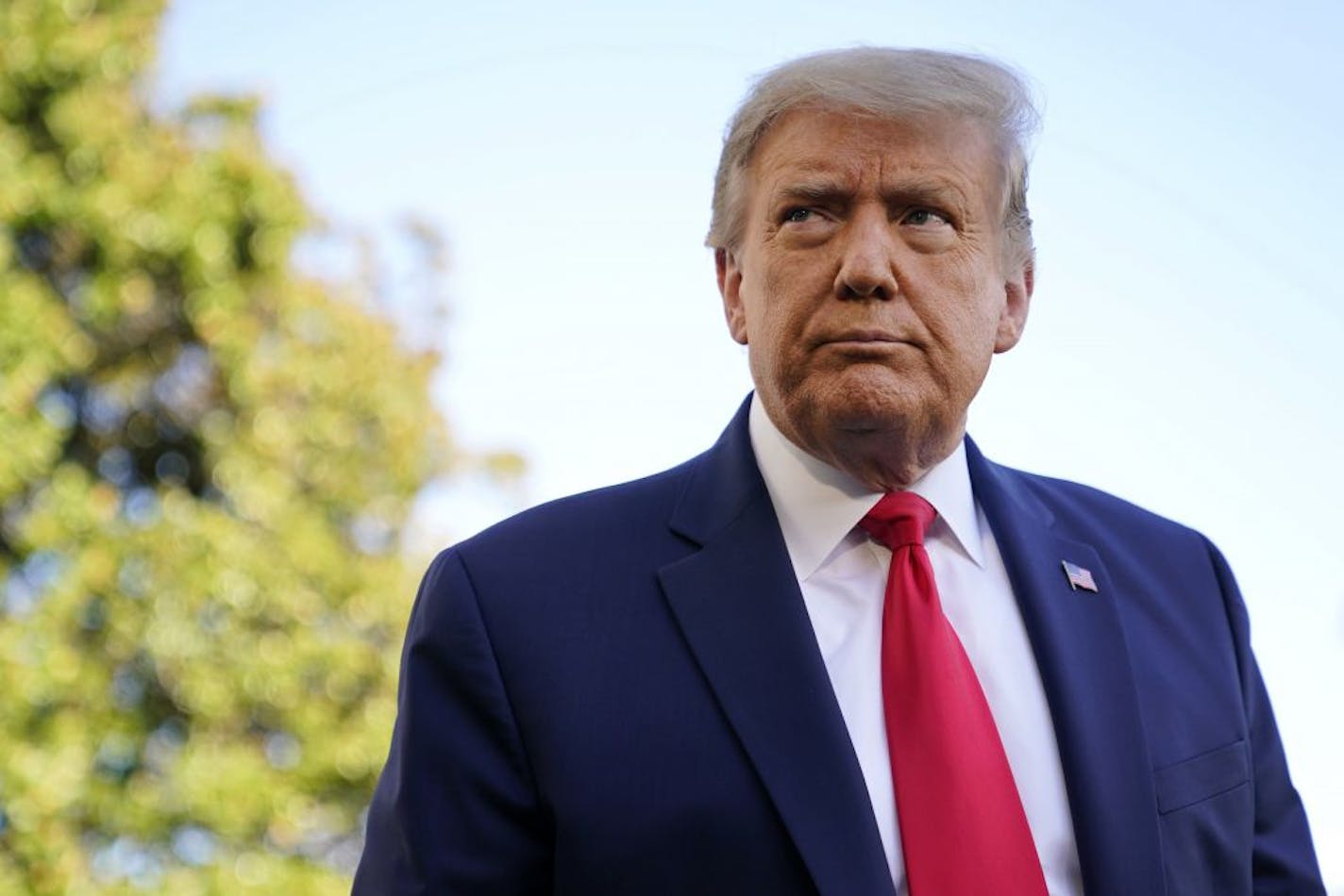 President Donald Trump listens to a reporter's question on the South Lawn of the White House, Saturday, Sept. 19, 2020, in Washington, before departing for a campaign rally in North Carolina.