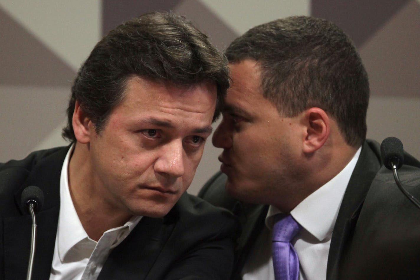 Wesley Batista, an executive at the world's largest meatpacker JBS, listens to his lawyer Ticiano Figueiredo, during his testimony at the Parliamentary Commission of Inquiry of the Federal Senate, in Brasilia, Brazil, Wednesday, Nov. 8, 2017. (AP Photo/Eraldo Peres) ORG XMIT: ERA103