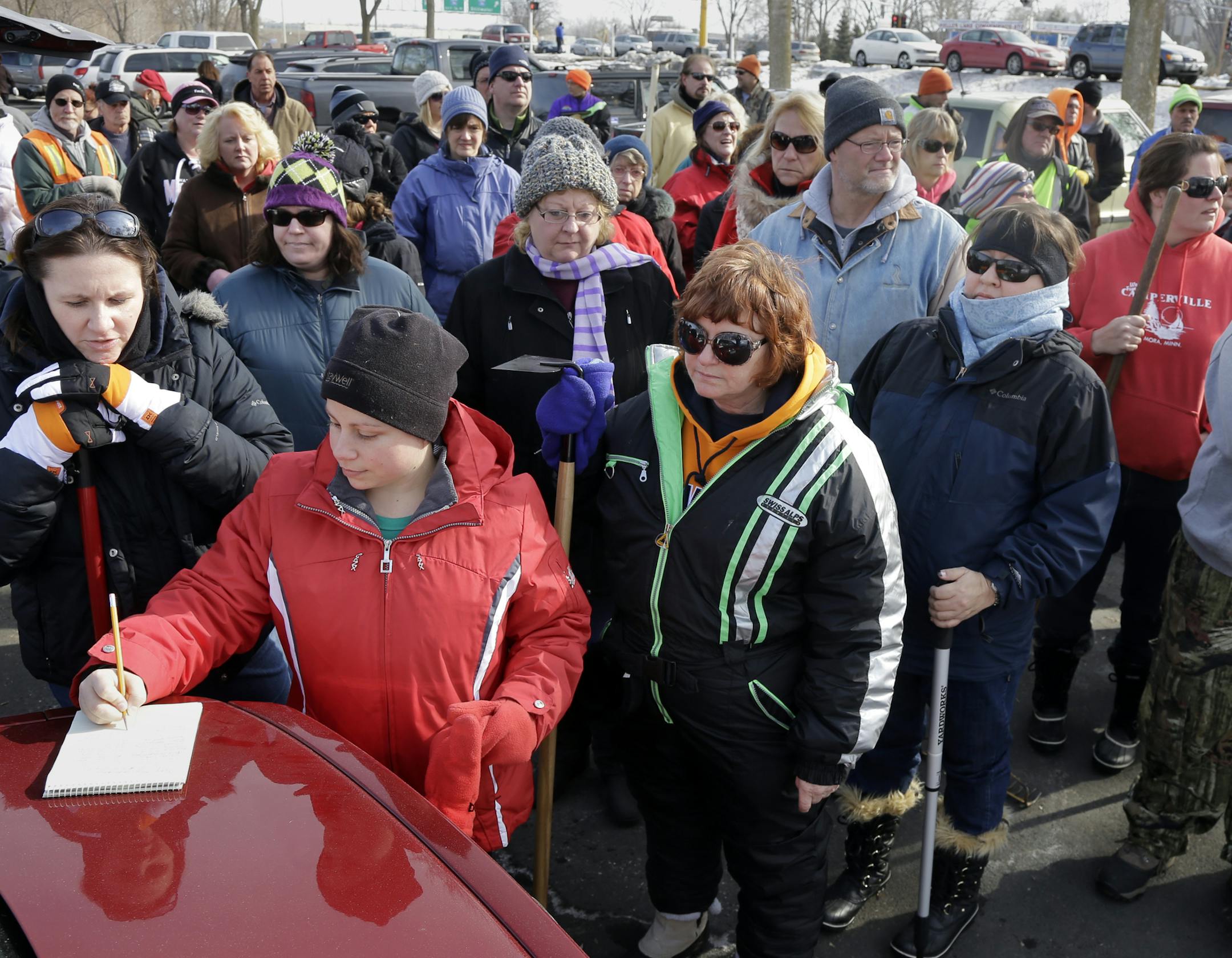 Robin Ring signs in at the morning search site. About 75 volunteers volunteers came to the call of Kira Trevino's family to search the Keller Lake area, Maplewood, MN., Saturday morning. The search was one of five conducted on March 23rd after items determined to be connected to Kira, through DNA tests, were found in the area last week . [ TOM WALLACE/STAR TRIBUNE Assignments #20028251B March 23, 2013 SLUG TREVINO0324 EXTRA INFORMATION Thirty-year-old Kira Trevino has been missing for nearly a m