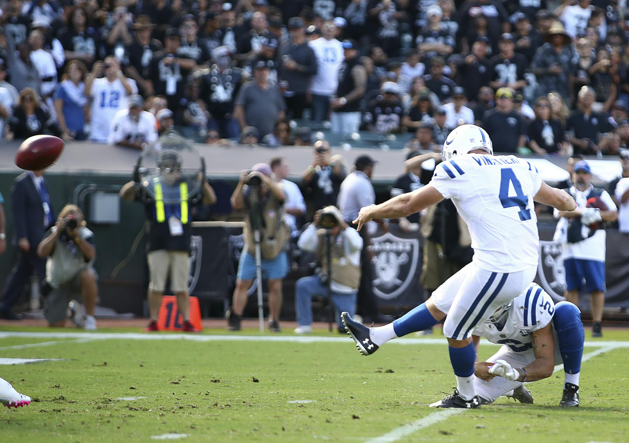 Indianapolis Colts kicker Adam Vinatieri (4) kicks a field goal against the Oakland Raiders during the first half of an NFL football game in Oakland, Calif., Sunday, Oct. 28, 2018. Vinatieri surpassed Morten Andersen's NFL record for points with this kick. (AP Photo/Ben Margot)