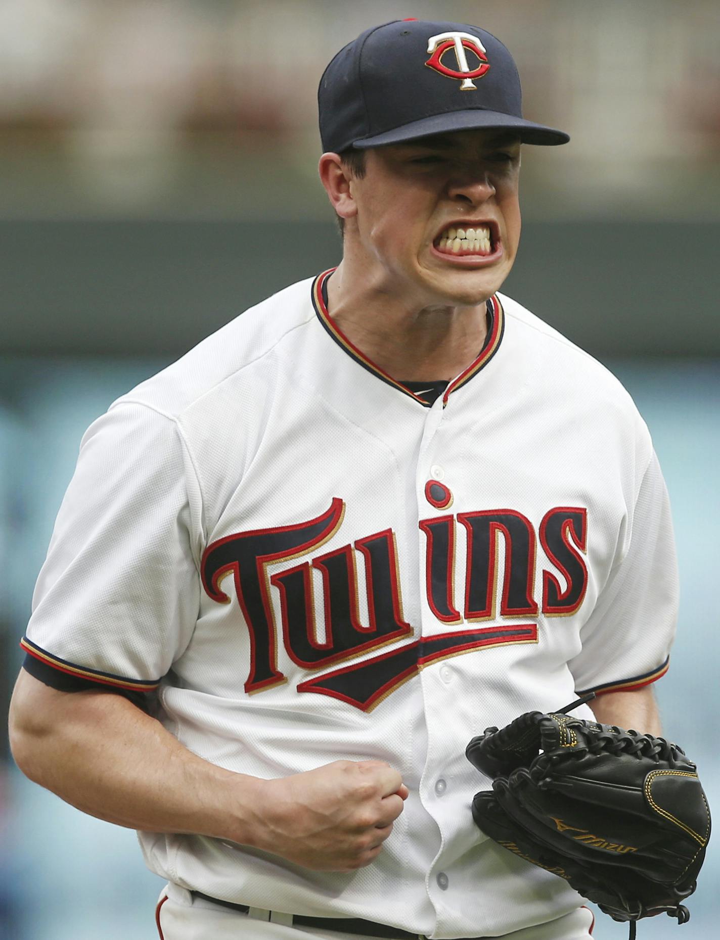 Minnesota Twins pitcher Trevor Hildenberger celebrates after striking out Detroit Tigers' Niko Goodrum for the final out of a baseball game Sunday, Aug. 19, 2018, in Minneapolis. Hildenberger got the win. (AP Photo/Jim Mone)