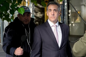 Michael Cohen leaves his apartment building on his way to Manhattan criminal court Monday in New York.