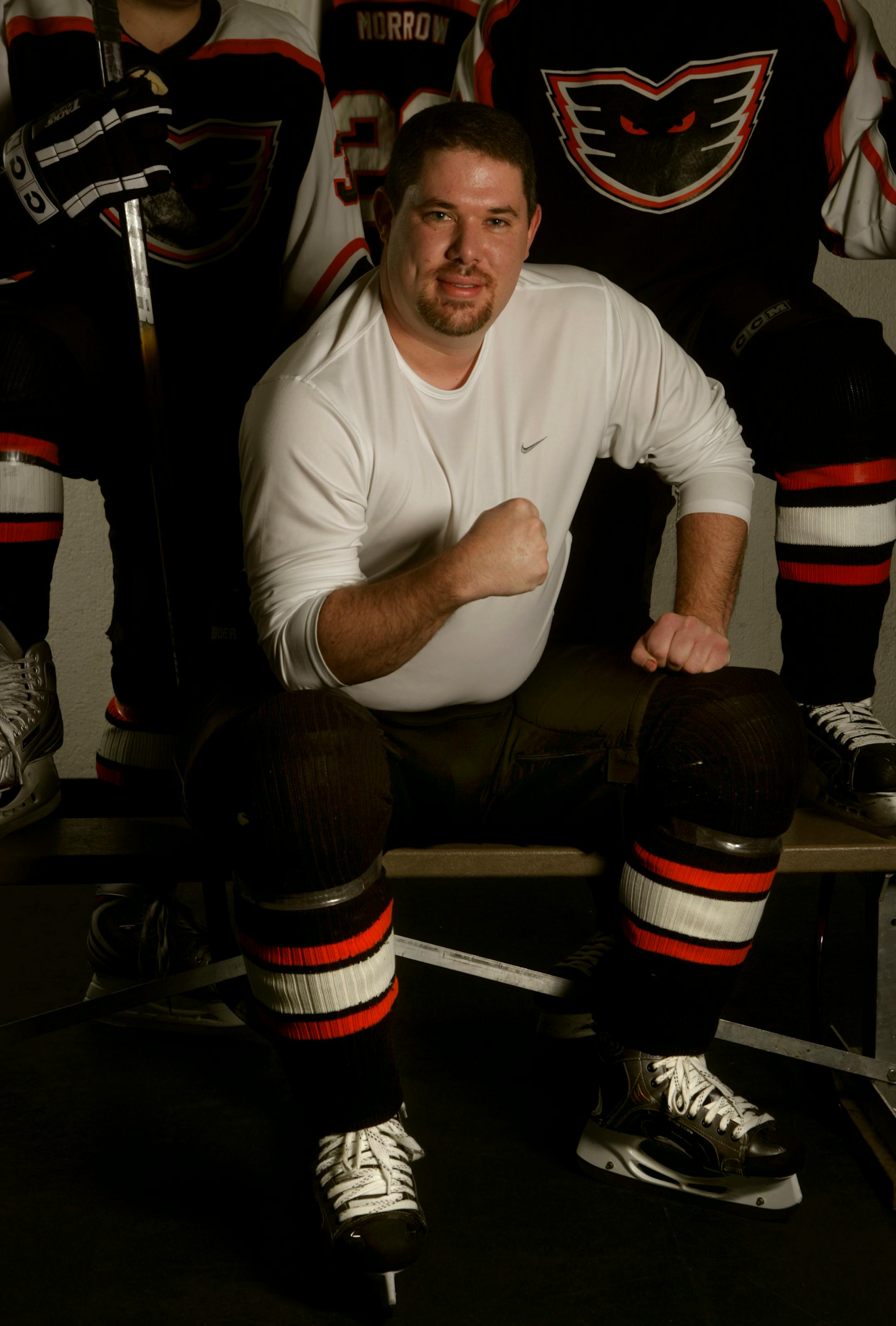 Pete Morrow waits on the bench for his shift on the ice. Pete Morrow plays hockey with the ' Phantoms'- a league for adult players that like to play hockey after they are finished with college or have a career.
