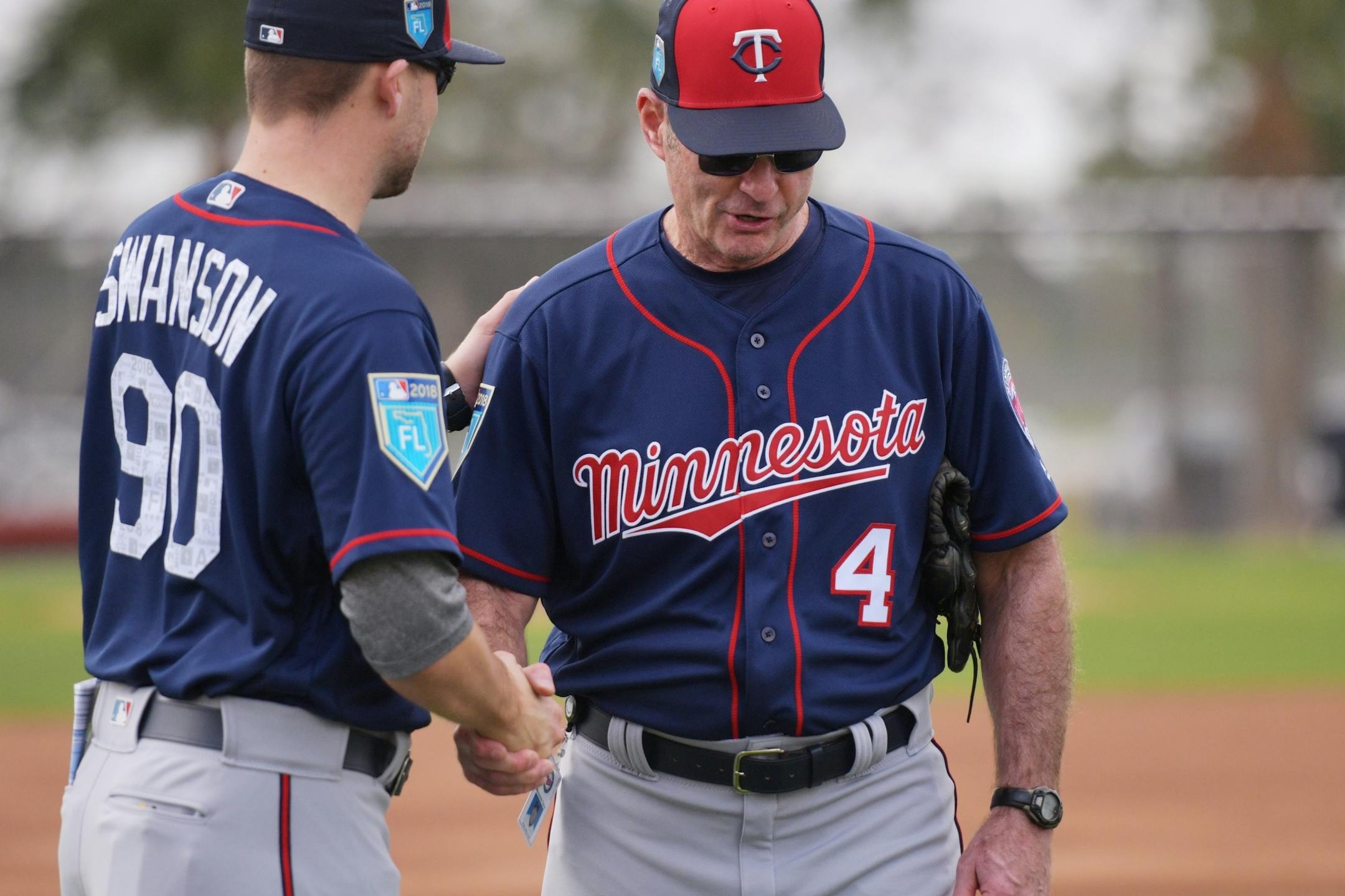 Twins manager Paul Moliter shook greeted minor league catchers coordinator Tanner Swanson.