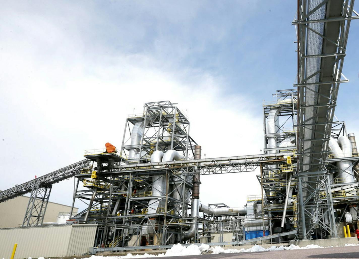 Dwayne Ehlert, 70, stands outside the shuttered Biofuels Energy Corp. ethanol plant in Fairmont, Minn.