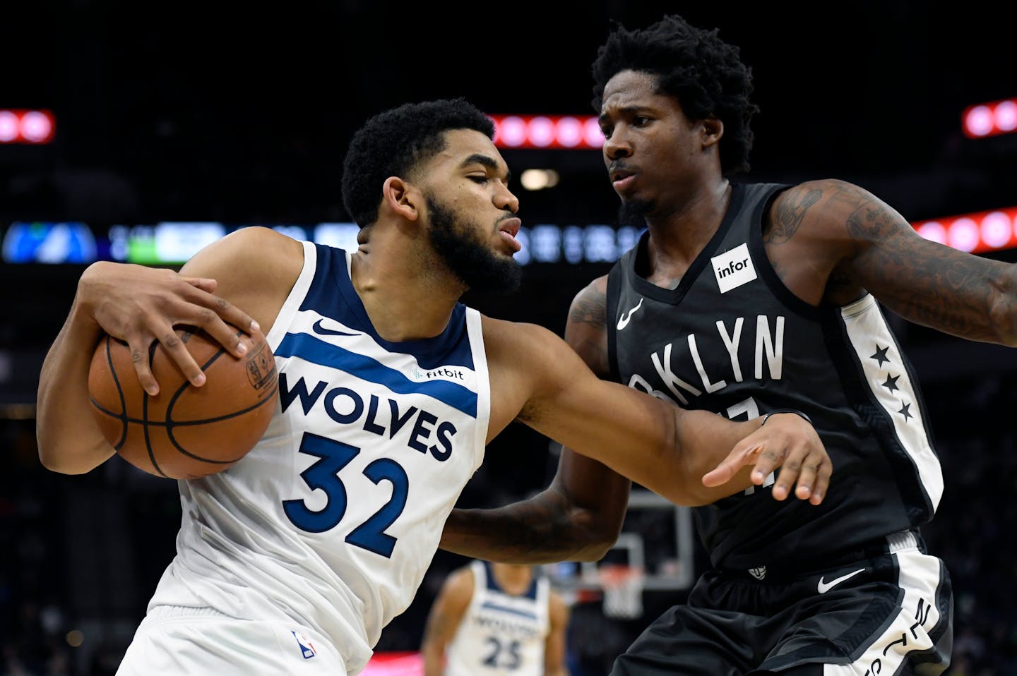 Brooklyn's Ed Davis guards the Timberwolves' Karl-Anthony Towns during the fourth quarter Monday.