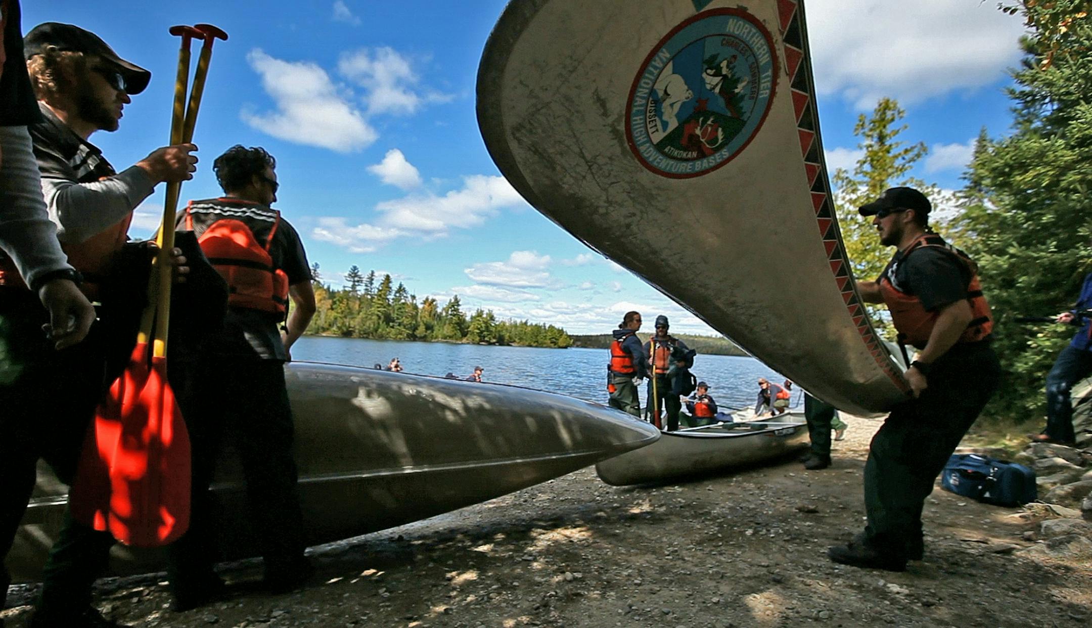 A group of 100 year-round U.S. Forest Service firefighters from Arizona and New Mexico learned to canoe on Moose Lake as they got ready to battle the Pagami Creek fire.