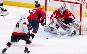 Capitals goaltender Darcy Kuemper (35) and defenseman Alexander Alexeyev (27) went after the puck, which was shot by Senators center Josh Norris on Mo