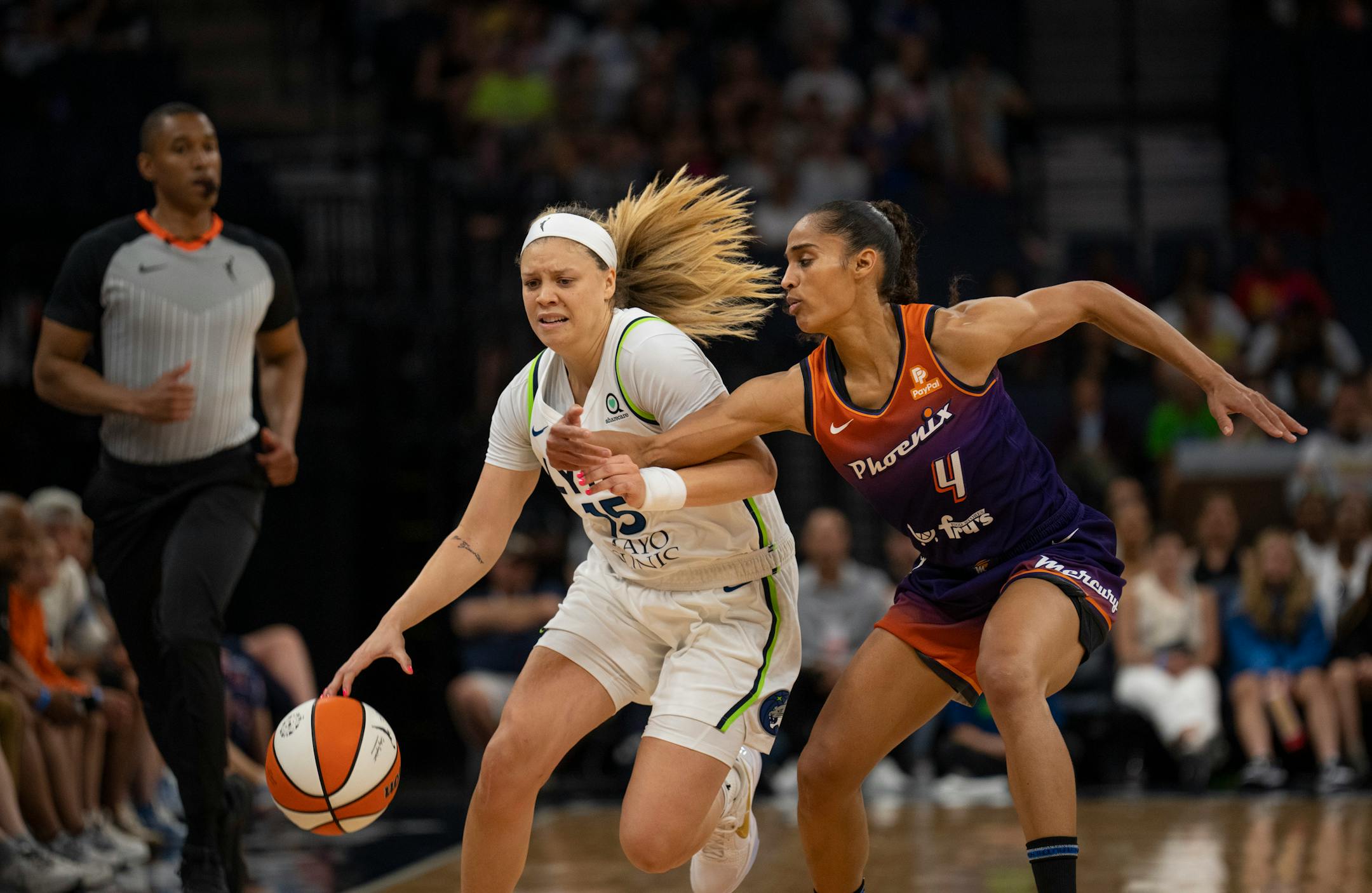 Minnesota Lynx guard Rachel Banham (15) fended off Phoenix Mercury guard Skylar Diggins-Smith (4) while bring the ball up court in the second quarter.