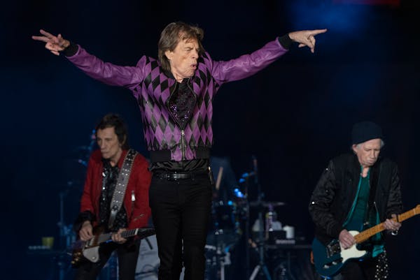 The Rolling Stones, including Mick Jagger, Ron Wood, back left, and Keith Richards perform at U.S. Bank Stadium.