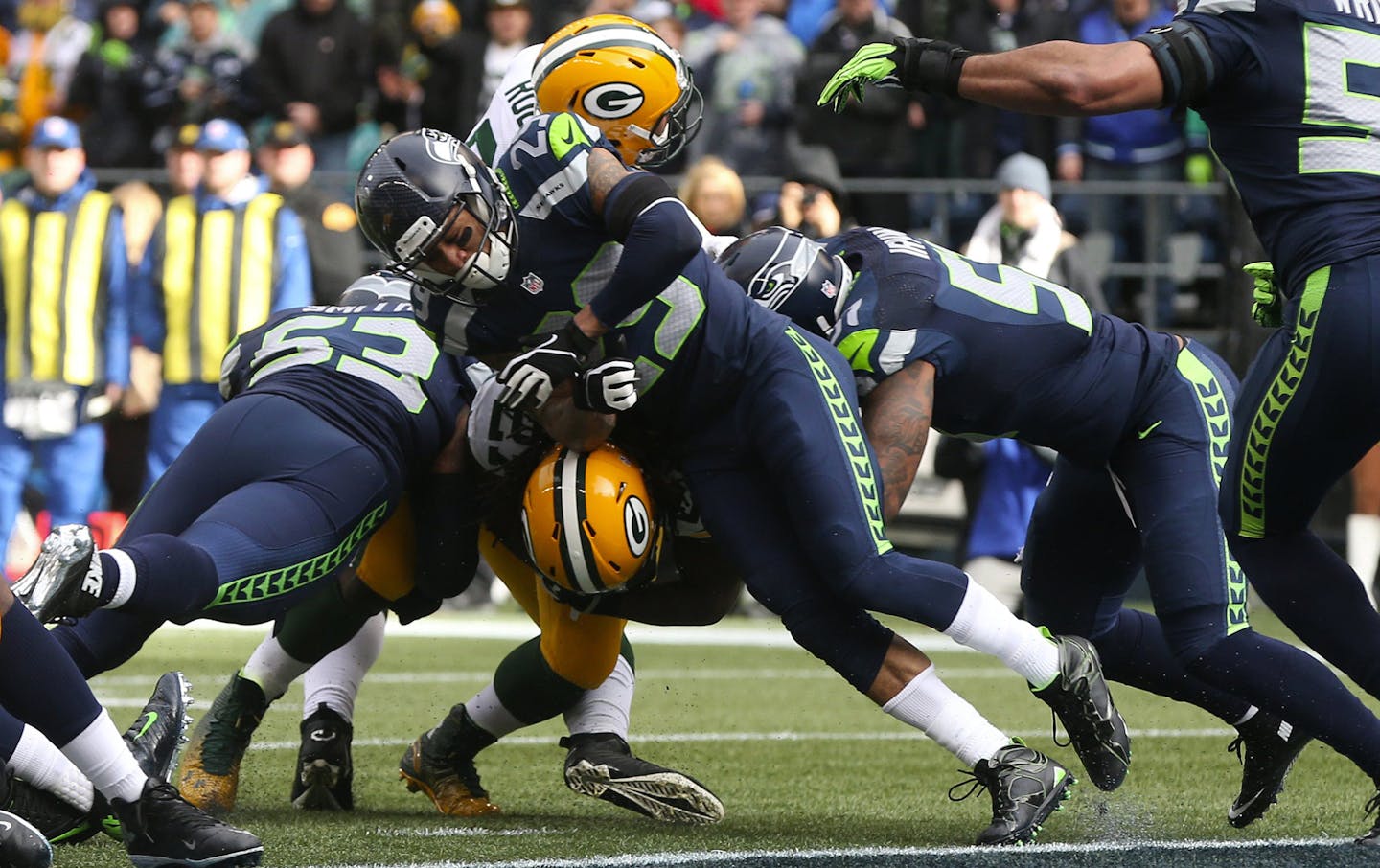 Seattle Seahawks safety Earl Thomas and the Seahawks defense combine to stop Green Bay Packers running back Eddie Lacy at the goal line during the first quarter on Sunday, Jan. 18, 2015, at CenturyLink Field in Seattle. (Bettina Hansen/Seattle Times/TNS) ORG XMIT: 1162794