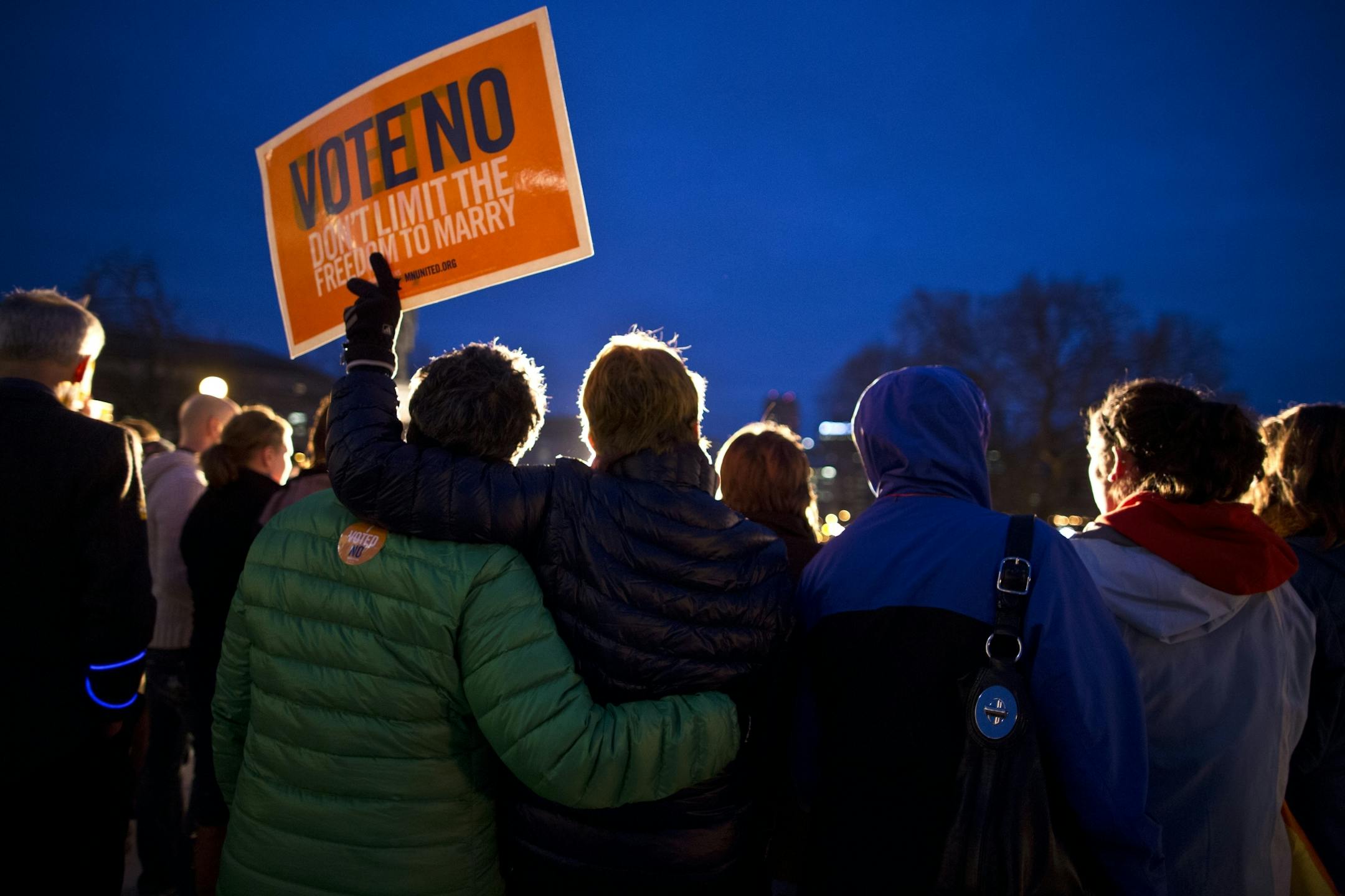 Opponents of an unsuccessful ballot effort to define marriage as between a man and a woman, including Cindy Amberger and Lynne Hvidsten (embracing) who have been a couple for 20 years, rallied outside the State Capitol in St. Paul, Minn. on Wednesday, November 7, 2012.
