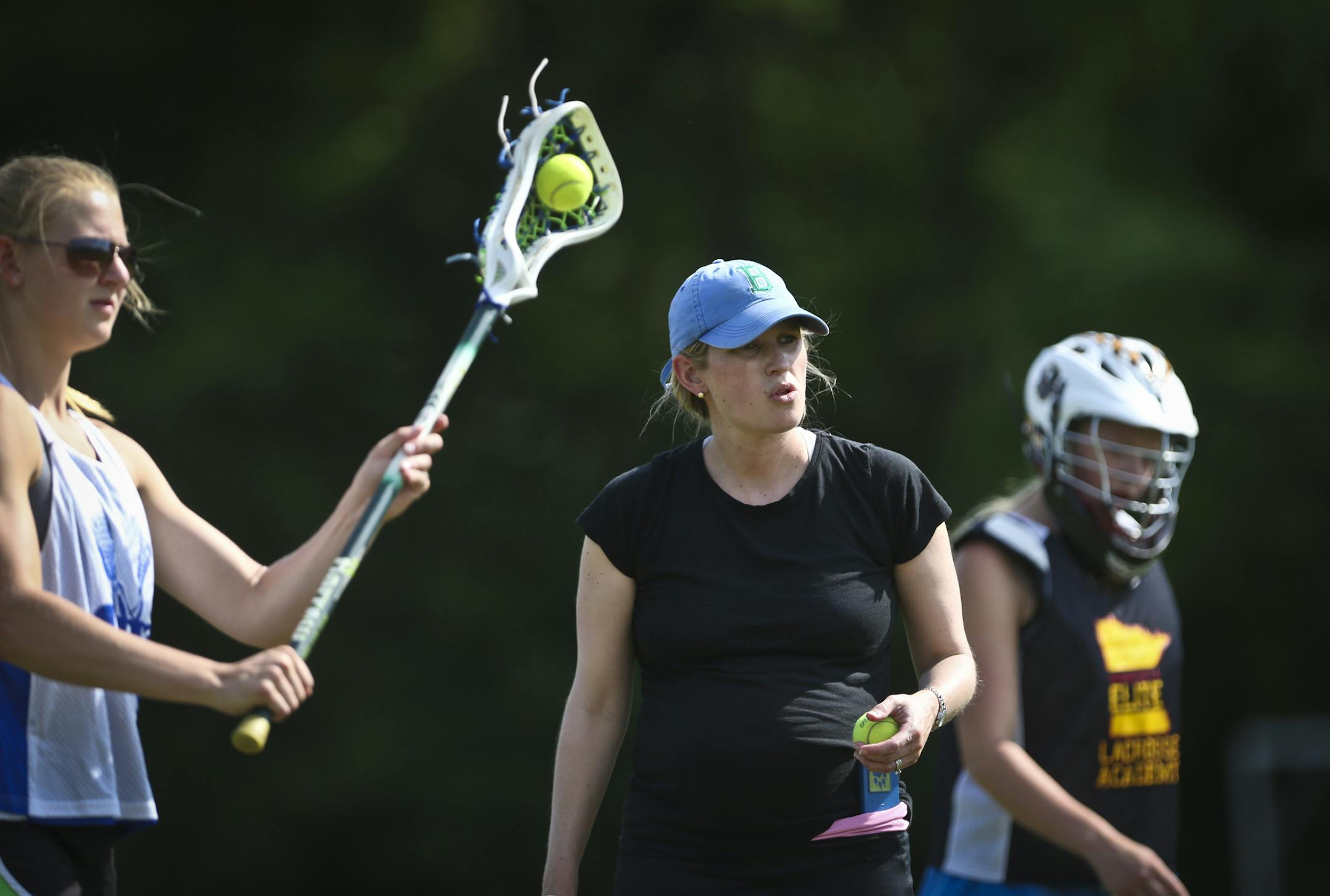 Coach Laura Mark (in hat) during practice on Friday, May 30, 2014, in Hopkins, Minn. ] RENEE JONES SCHNEIDER • reneejones@startribune.com